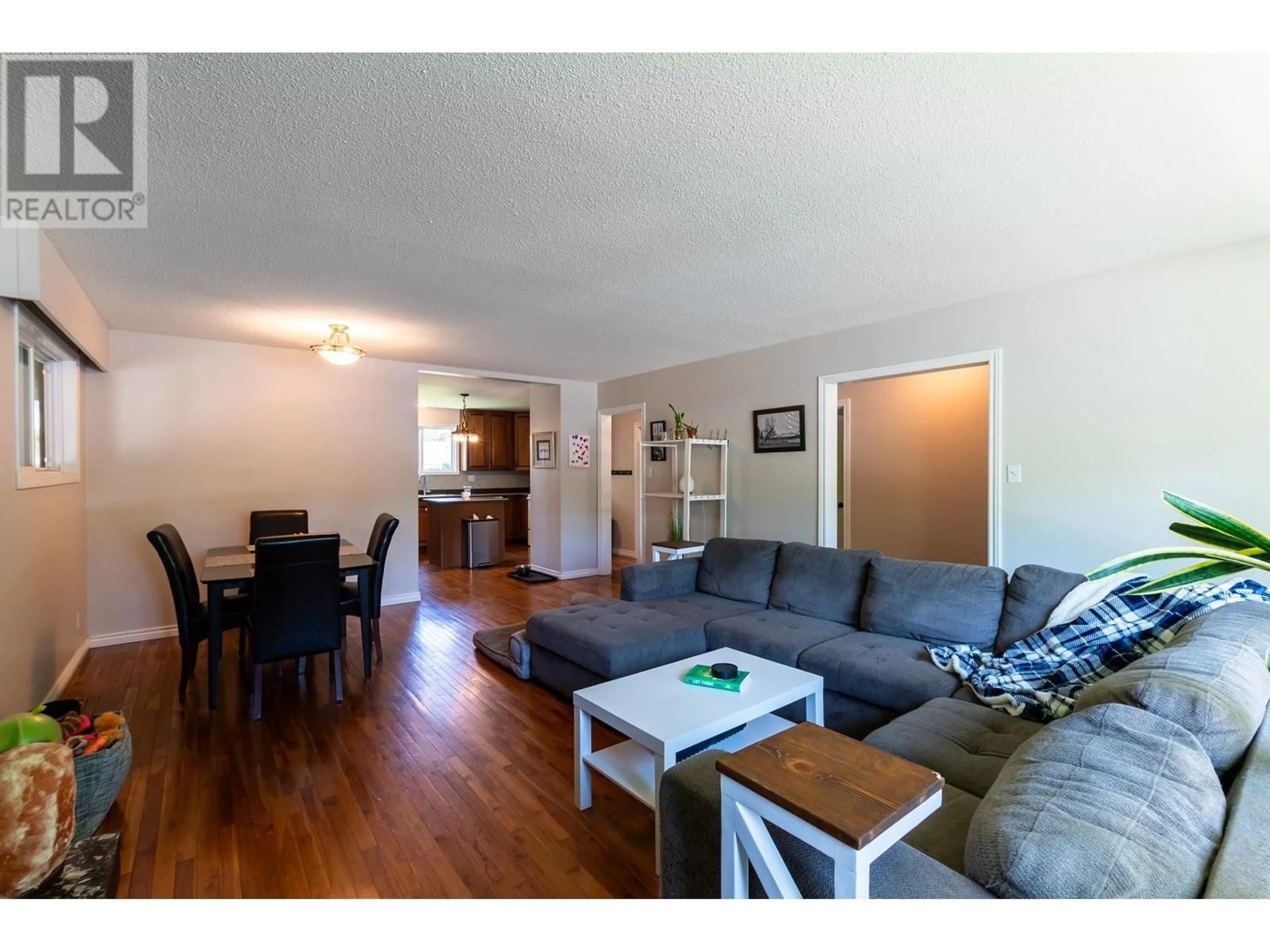 Living room with furniture, wood/laminate floor for 1678 KENWOOD STREET, Prince George British Columbia V2L1S2