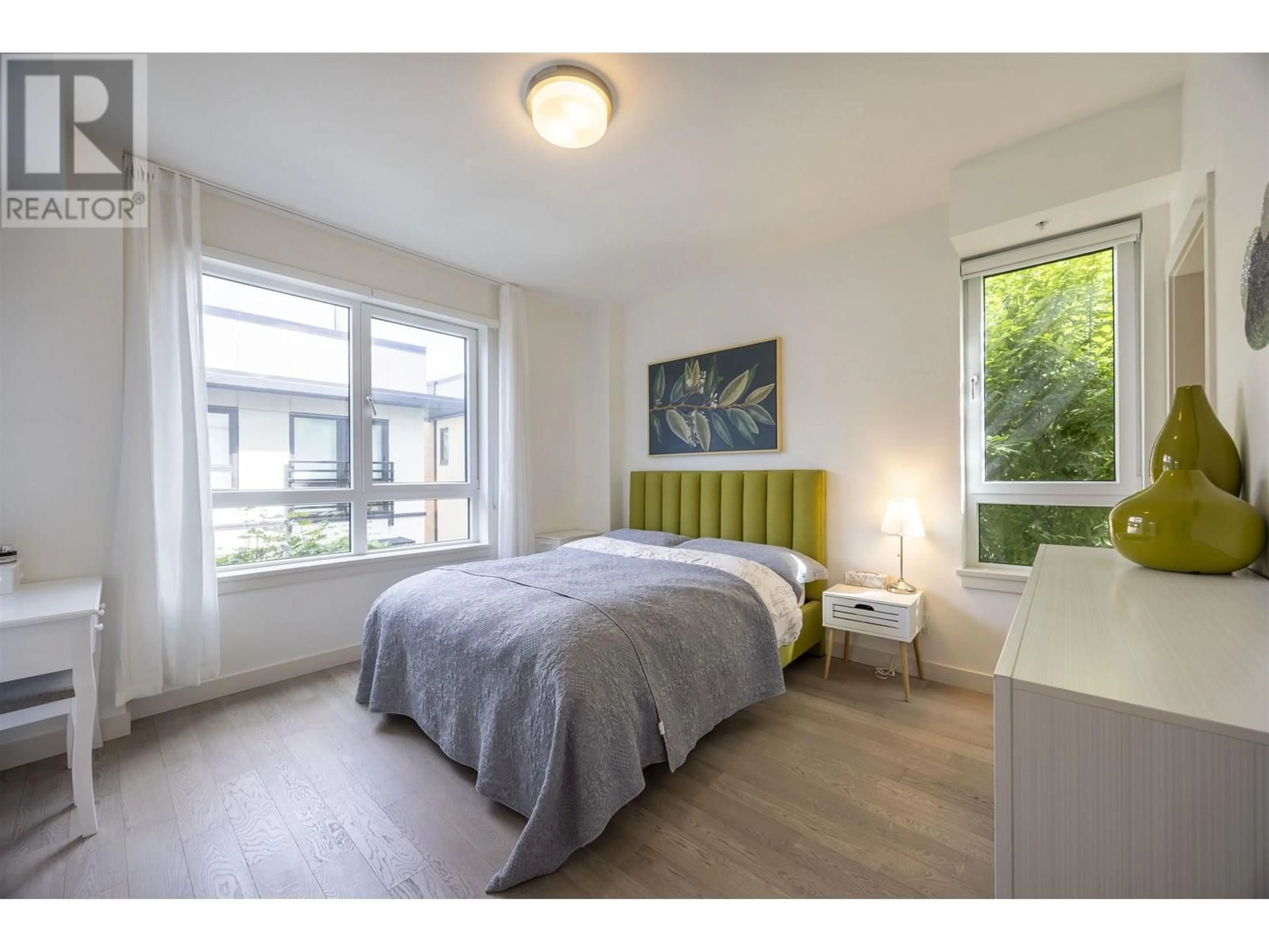 Bedroom with bed, wood/laminate floor for 208 - 4408 CAMBIE STREET, Vancouver British Columbia V5Y0M2