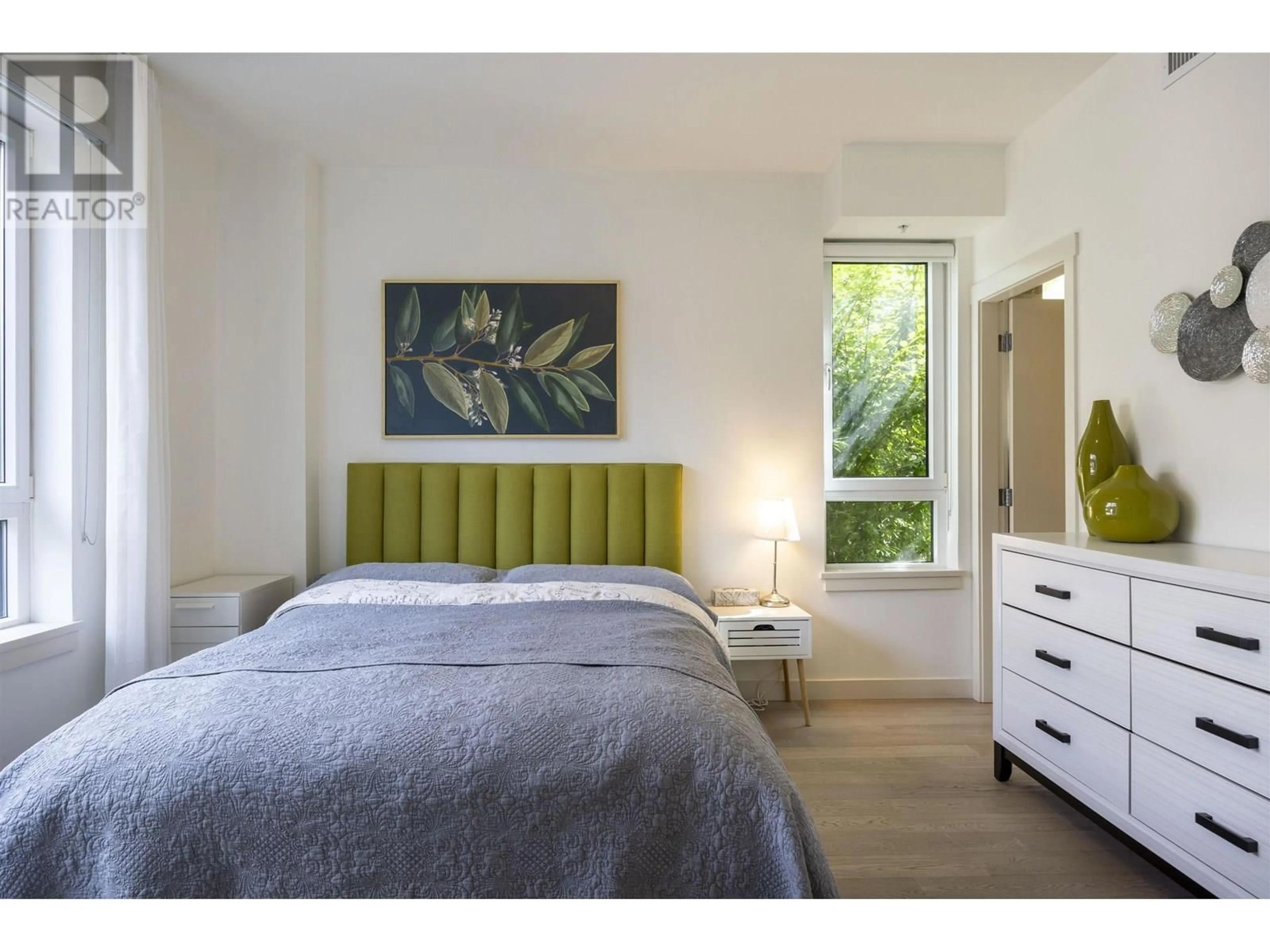 Bedroom with bed, wood/laminate floor for 208 - 4408 CAMBIE STREET, Vancouver British Columbia V5Y0M2