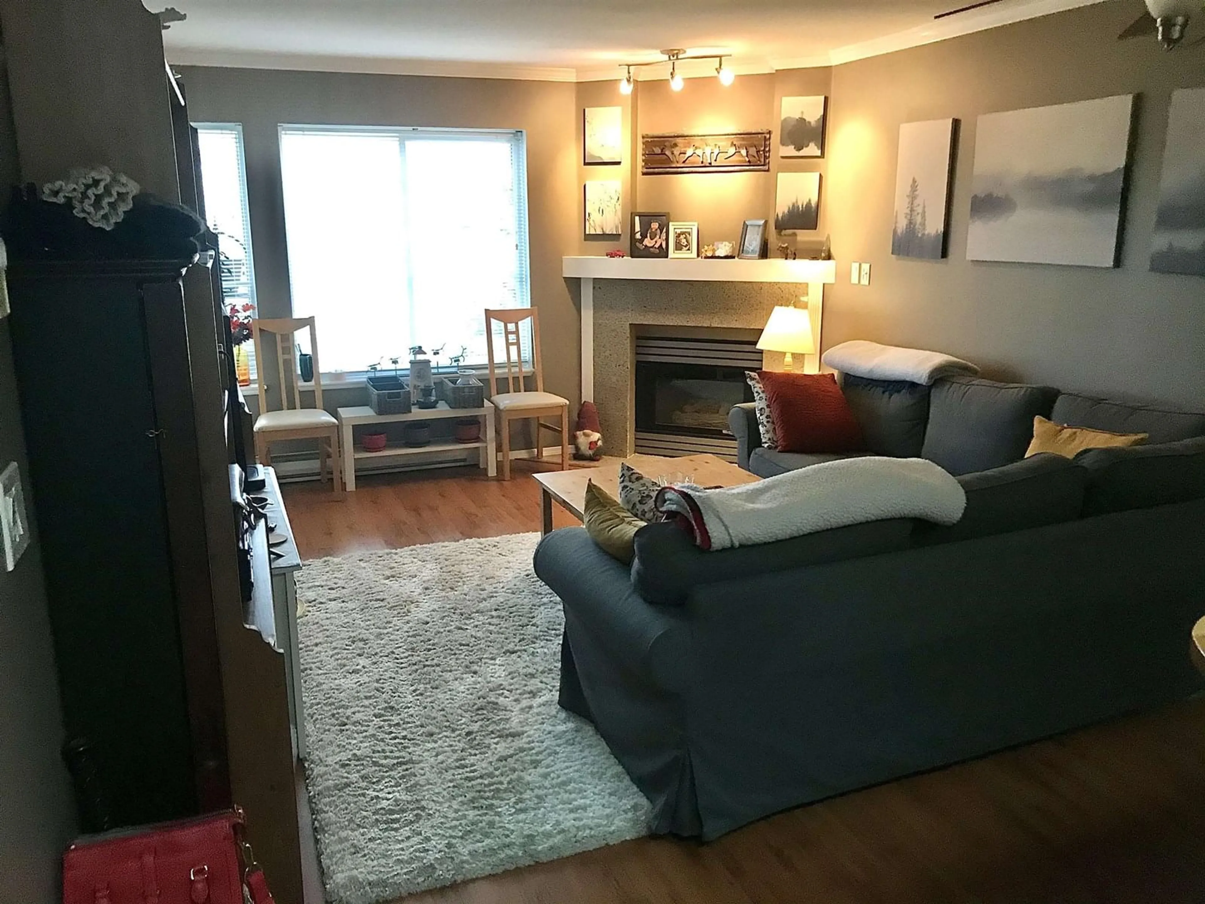 Living room with furniture, wood/laminate floor for 304 - 10665 139, Surrey British Columbia V3T4L8