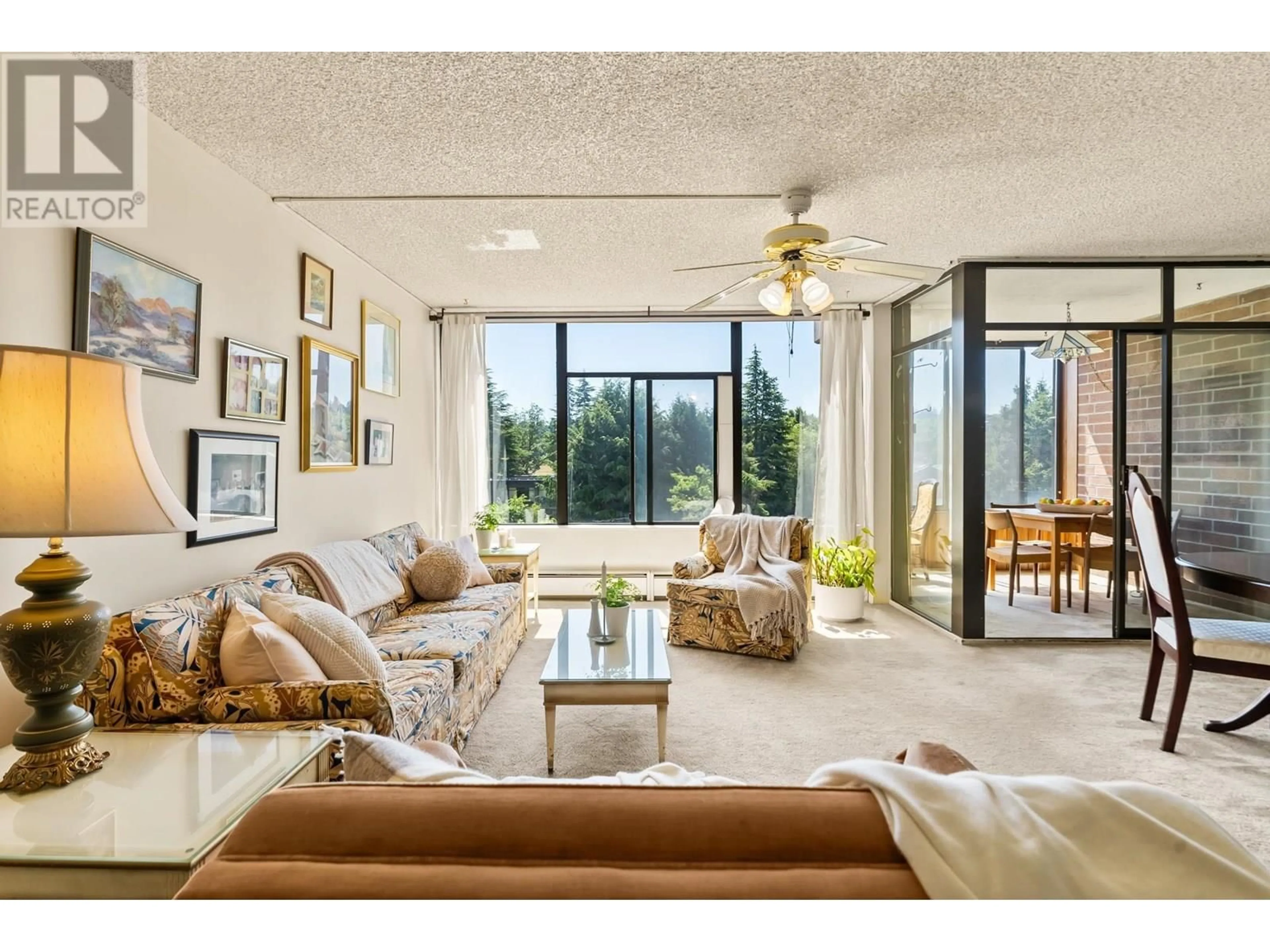 Living room with furniture, ceramic/tile floor for 405 - 2101 MCMULLEN AVENUE, Vancouver British Columbia V6L3B4