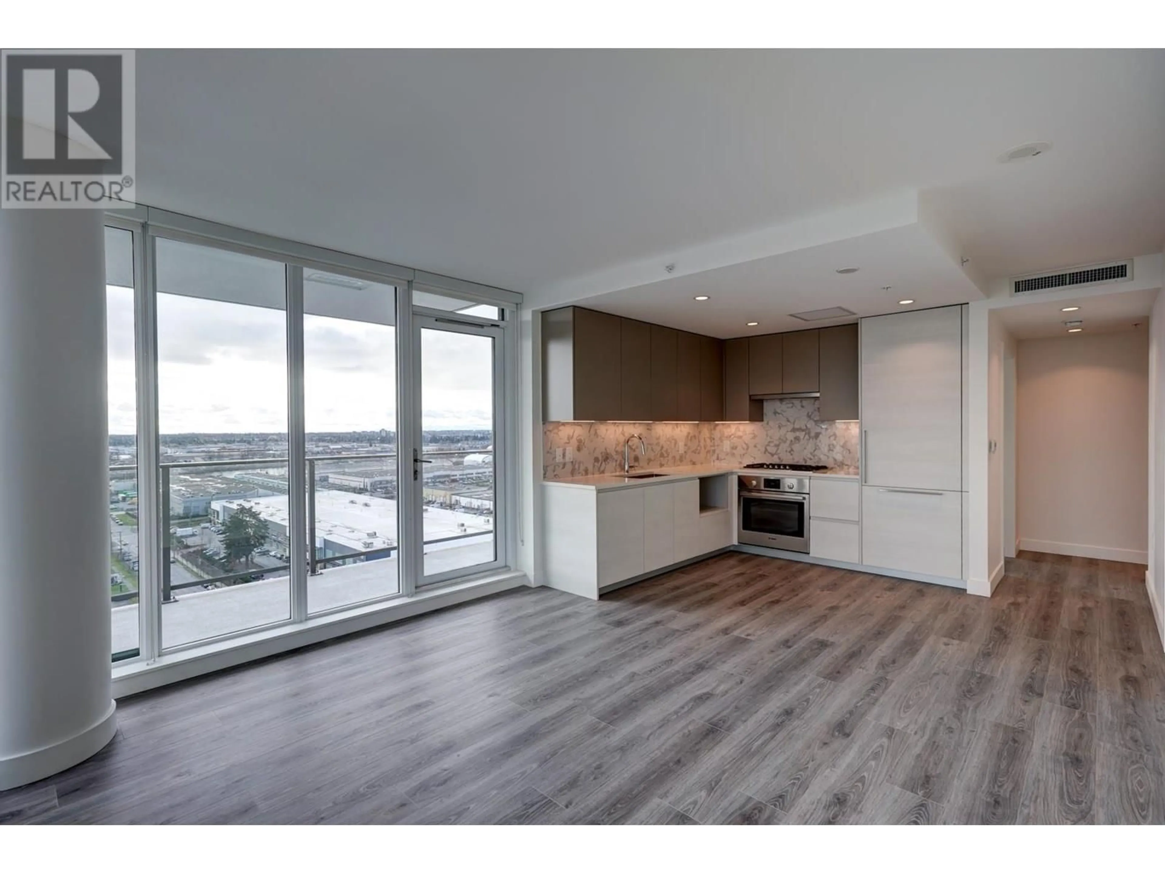 Open concept kitchen, wood/laminate floor for 1502 - 8188 FRASER STREET, Vancouver British Columbia V5X0J8