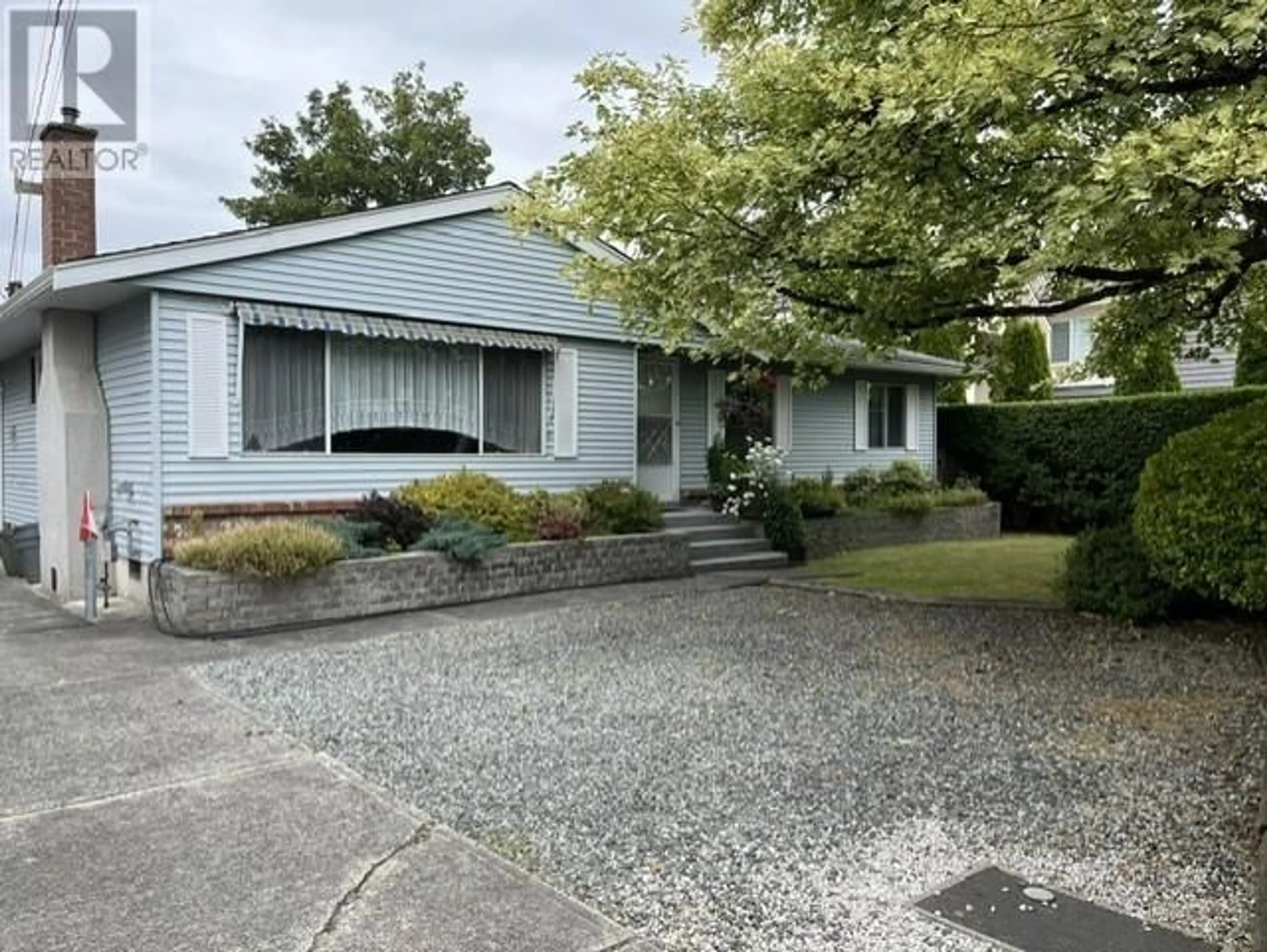 A pic from outside/outdoor area/front of a property/back of a property/a pic from drone, street for 7571 PETTS ROAD, Richmond British Columbia V7A1J9