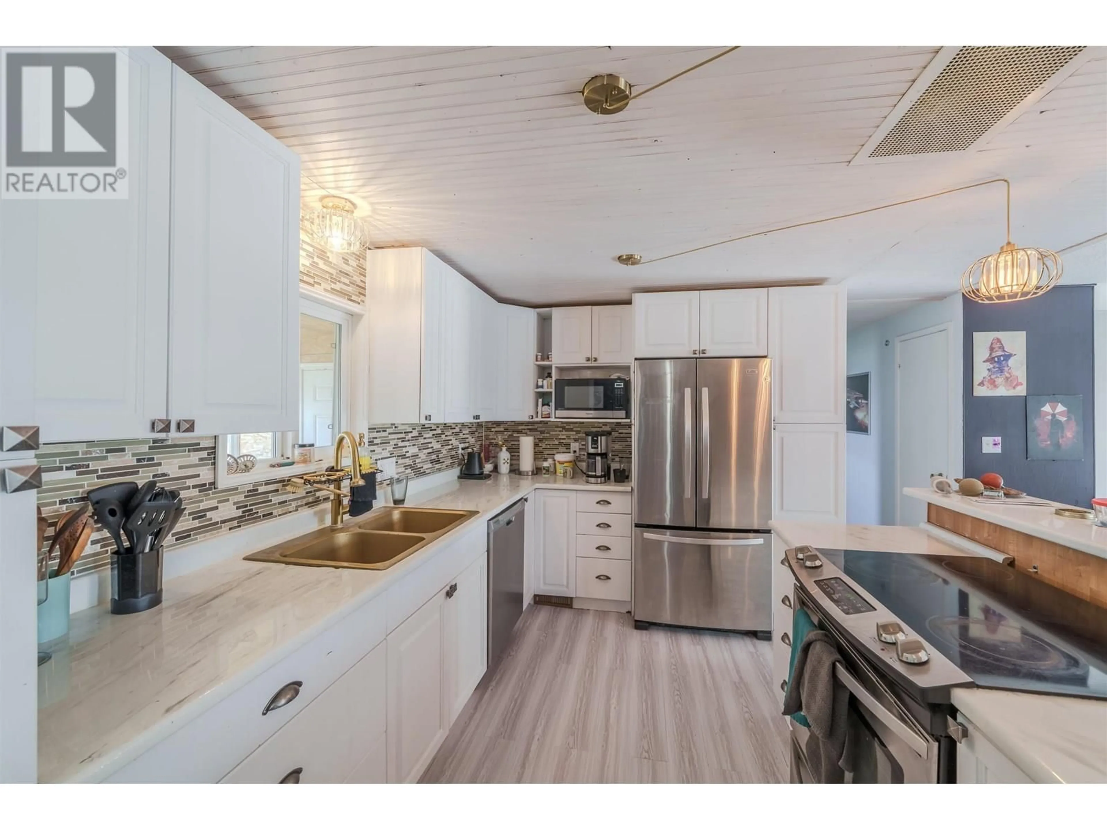 Open concept kitchen, unknown for 287 ELM AVENUE, 100 Mile House British Columbia V0K2E0