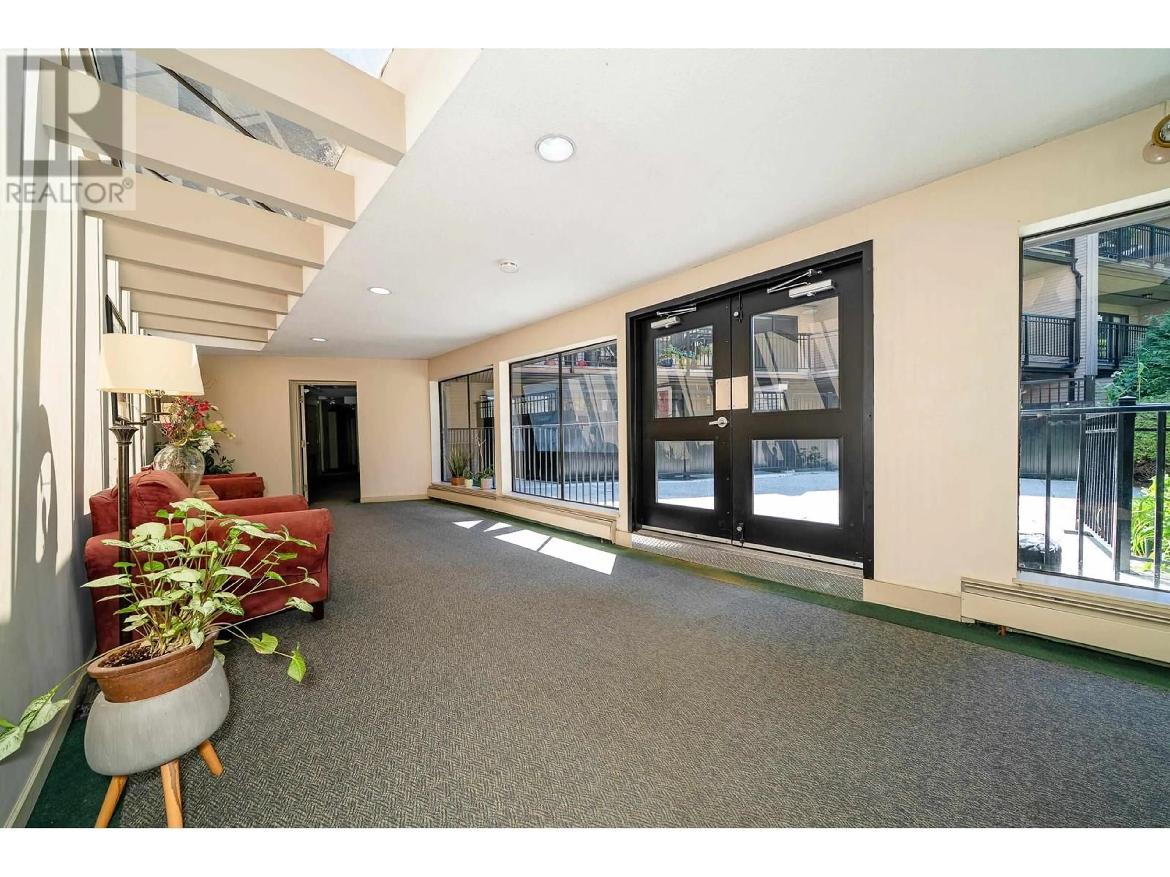 Indoor foyer for 214 - 1385 DRAYCOTT ROAD, North Vancouver British Columbia V7J3K9