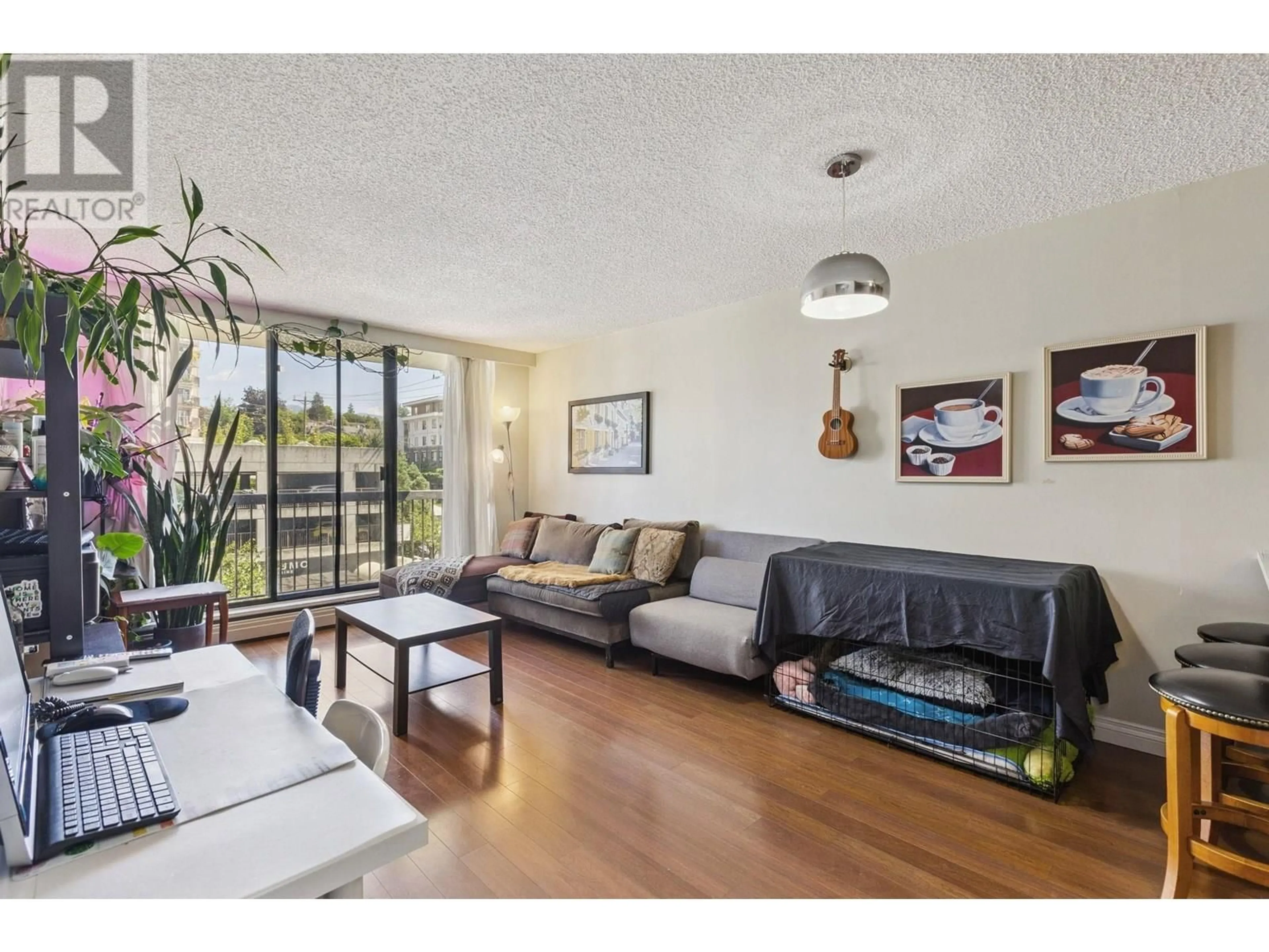Living room with furniture, wood/laminate floor for 405 - 145 ST. GEORGES AVENUE, North Vancouver British Columbia V7L3G8