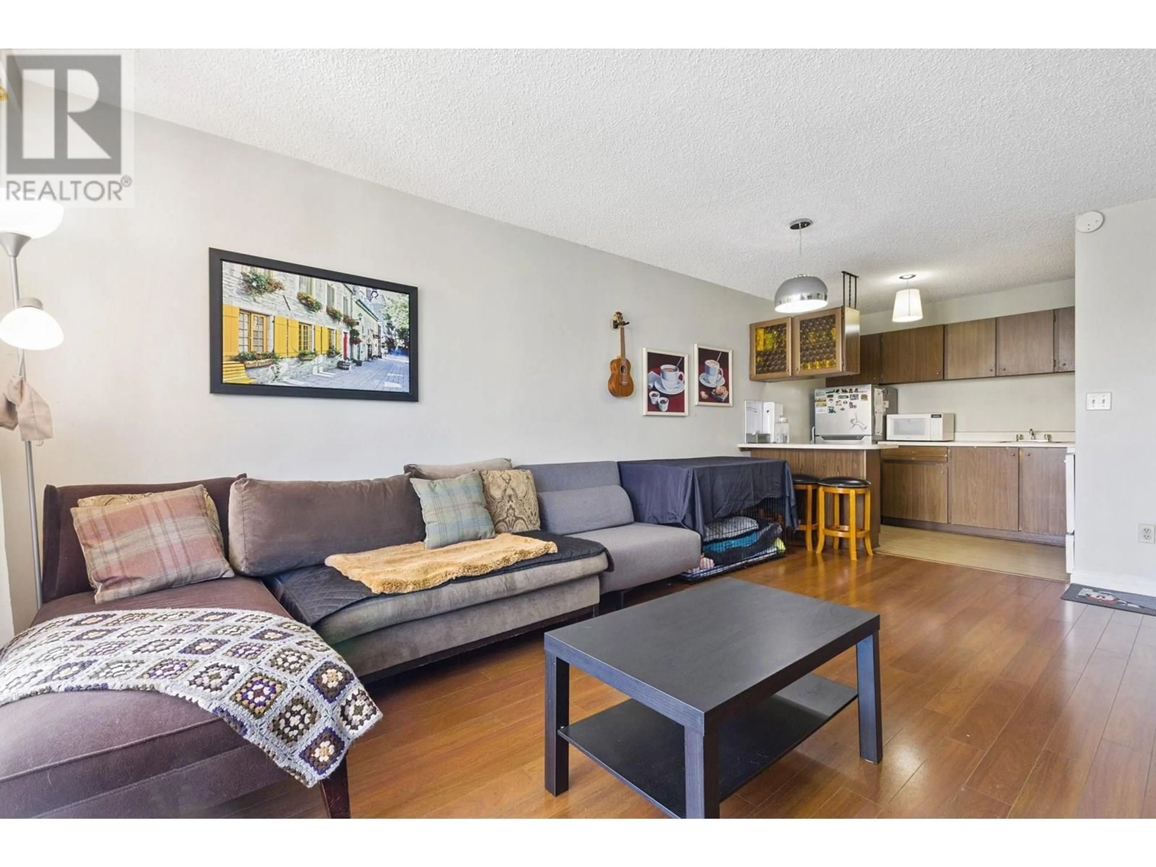 Living room with furniture, wood/laminate floor for 405 - 145 ST. GEORGES AVENUE, North Vancouver British Columbia V7L3G8