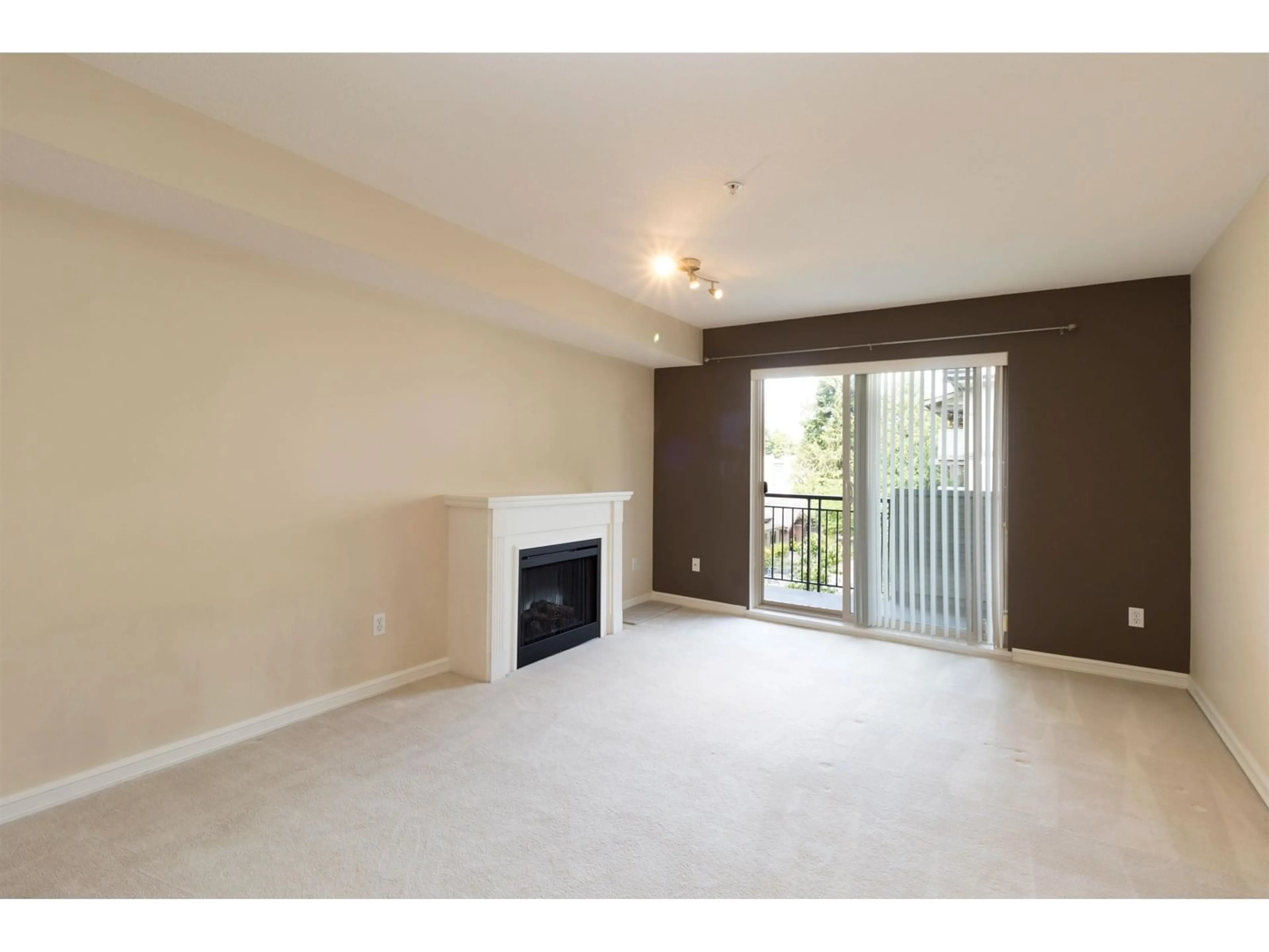 Living room with furniture, wood/laminate floor for 311 - 10088 148, Surrey British Columbia V3R3M9