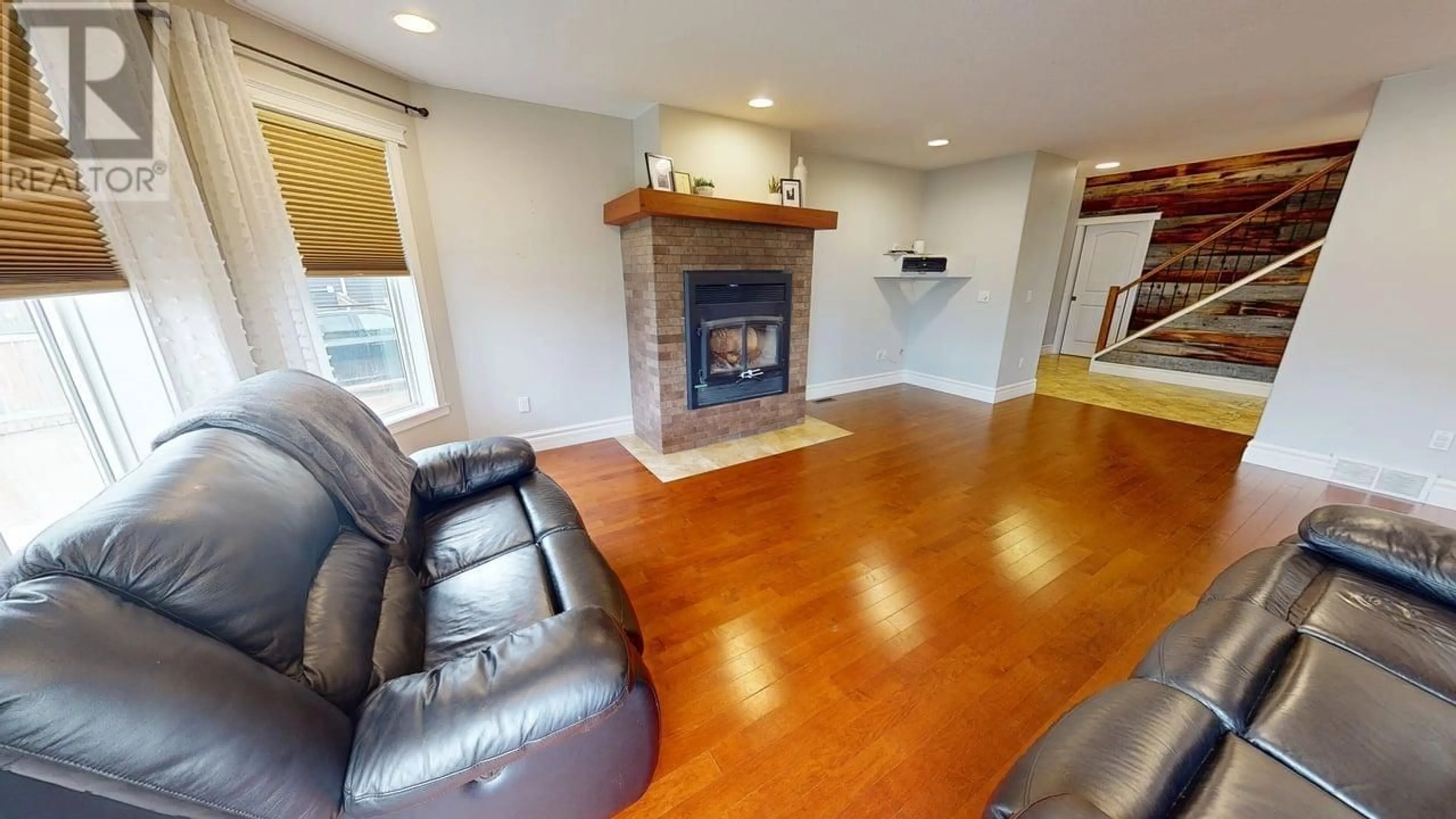 Living room with furniture, wood/laminate floor for 11716 88 STREET, Fort St. John British Columbia V1J0H8