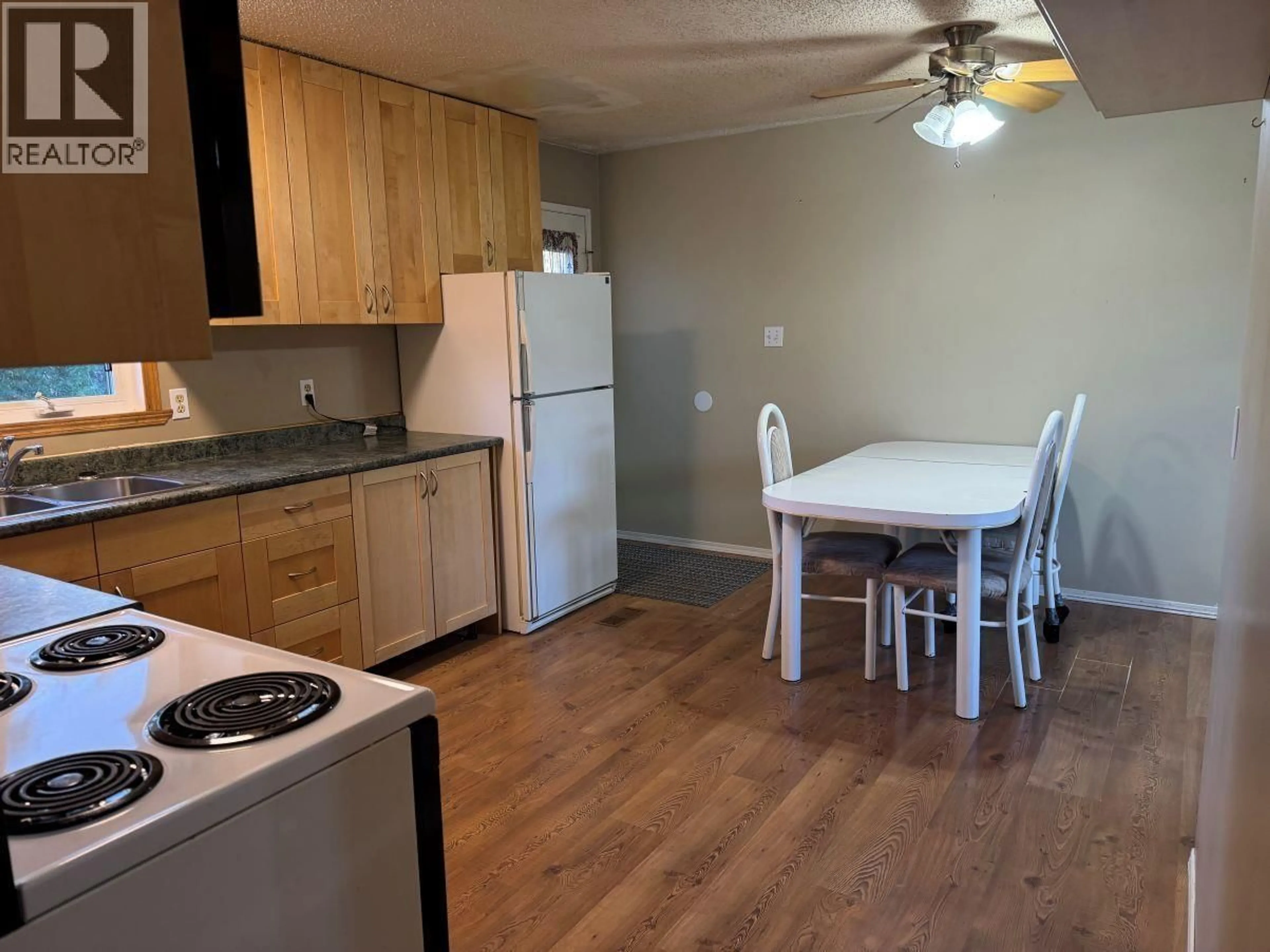 Standard kitchen, wood/laminate floor for 18 MUNRO CRESCENT, Mackenzie British Columbia V0J2C0