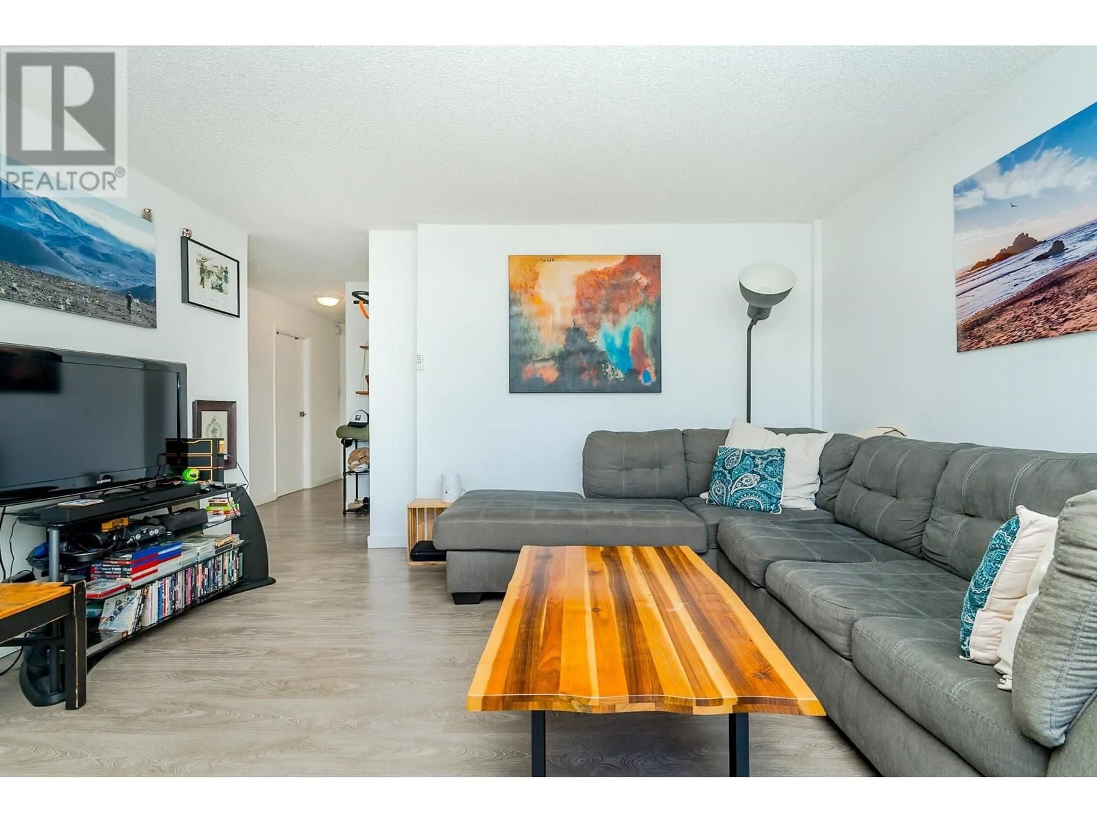 Living room with furniture, wood/laminate floor for 1204 - 4105 MAYWOOD STREET, Burnaby British Columbia V5H4A3