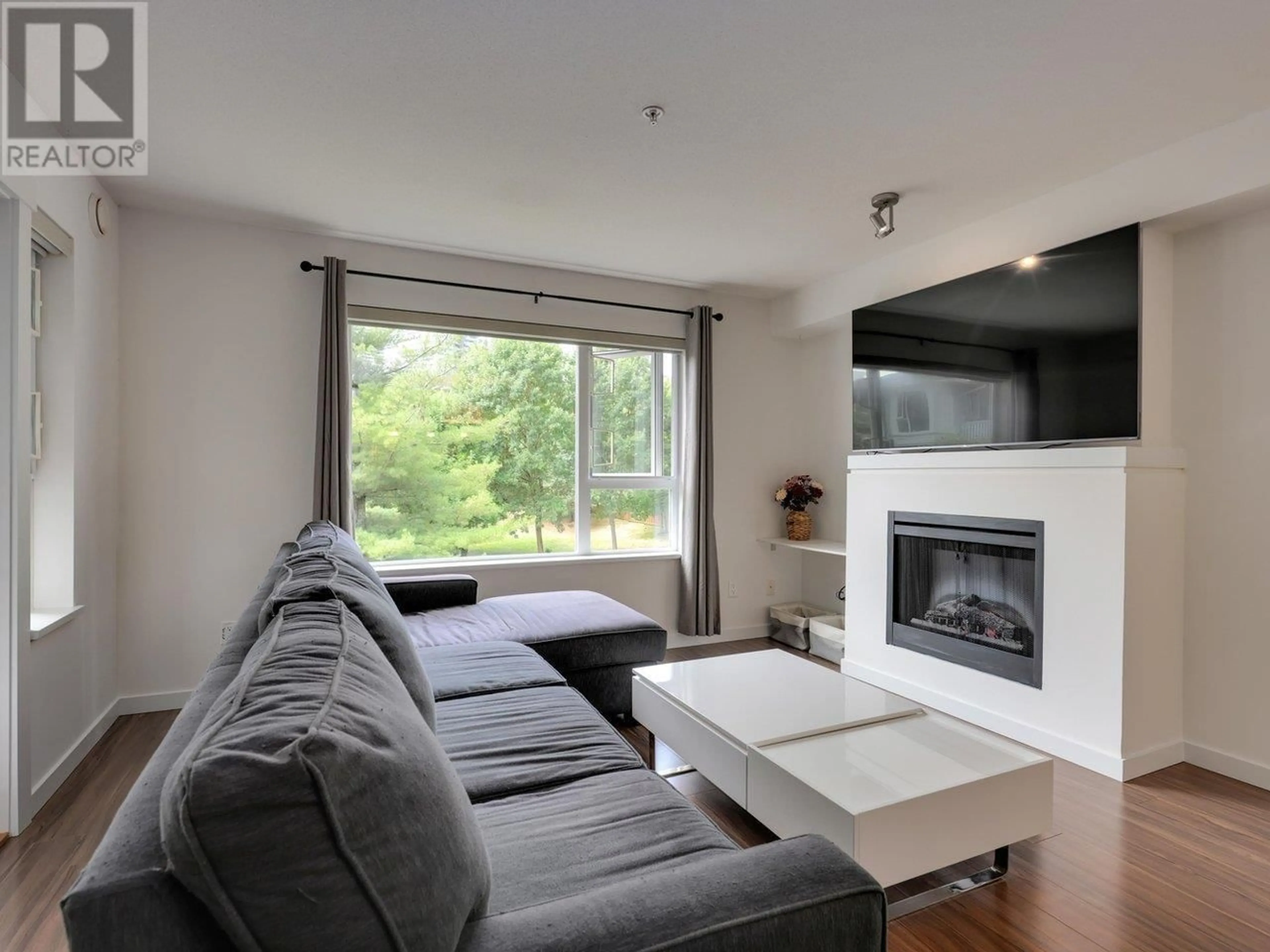 Living room with furniture, wood/laminate floor for 303 - 4783 DAWSON STREET, Burnaby British Columbia V5C0A8