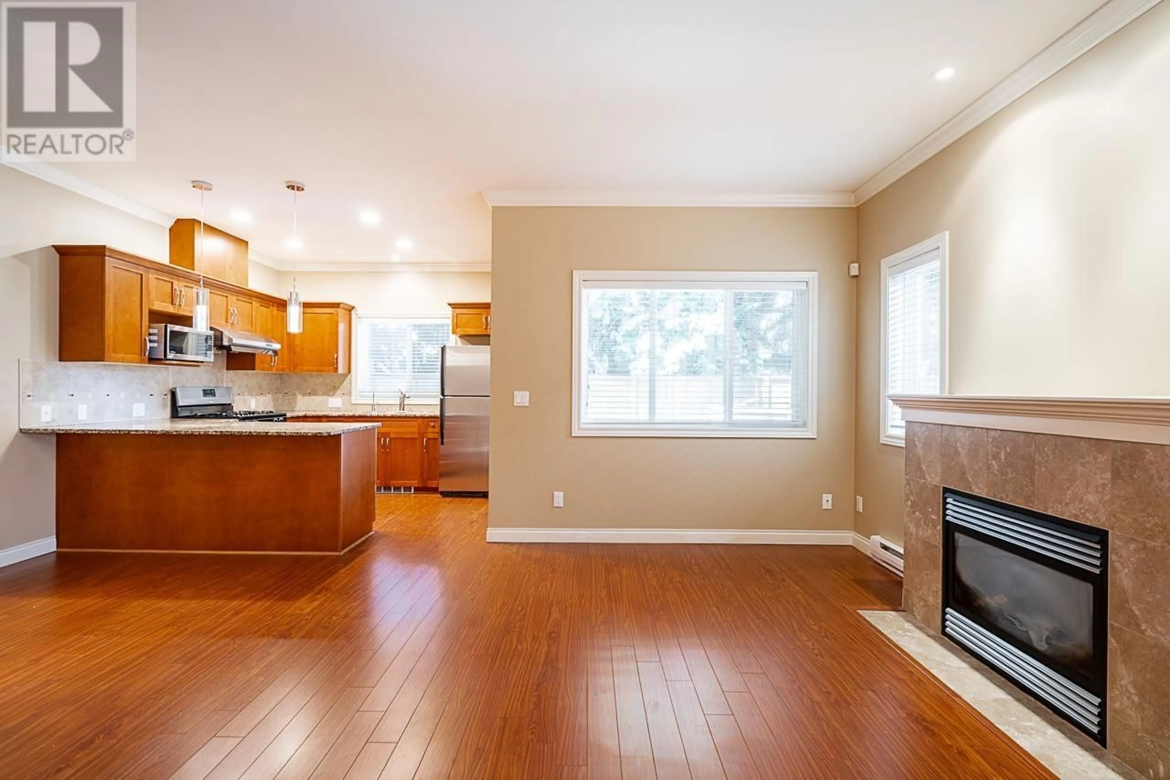 Open concept kitchen, wood/laminate floor for 11 - 8311 NO. 2 ROAD, Richmond British Columbia V7C3M2