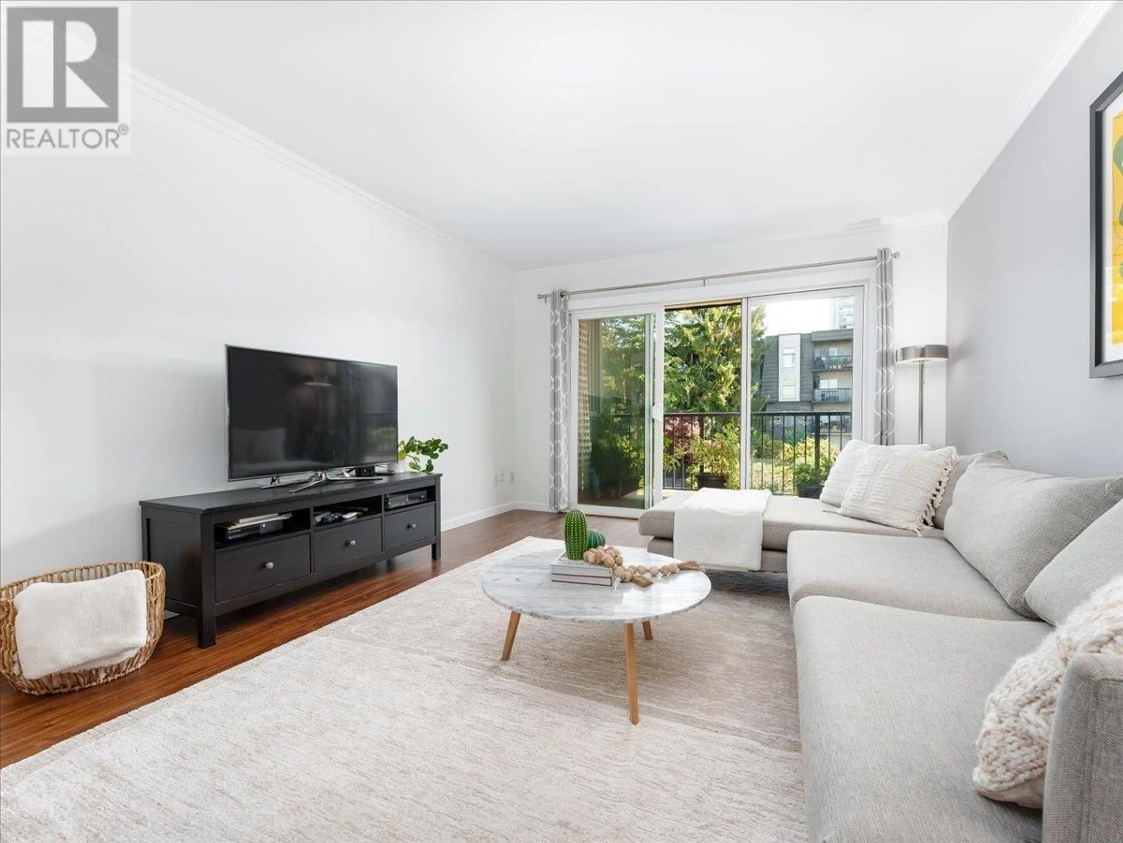 Living room with furniture, unknown for 301 - 155 5TH STREET, North Vancouver British Columbia V7L1L3