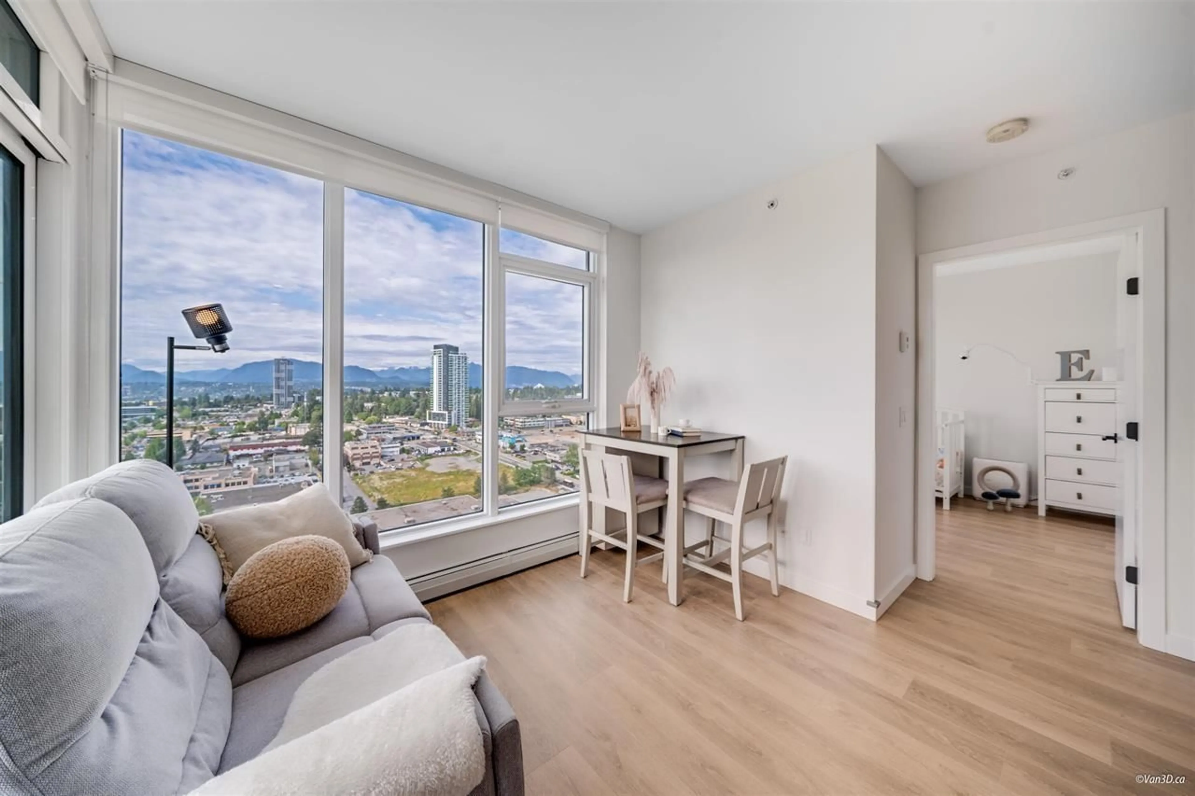 Living room with furniture, wood/laminate floor for 2211 - 13685 102, Surrey British Columbia V3T0S2