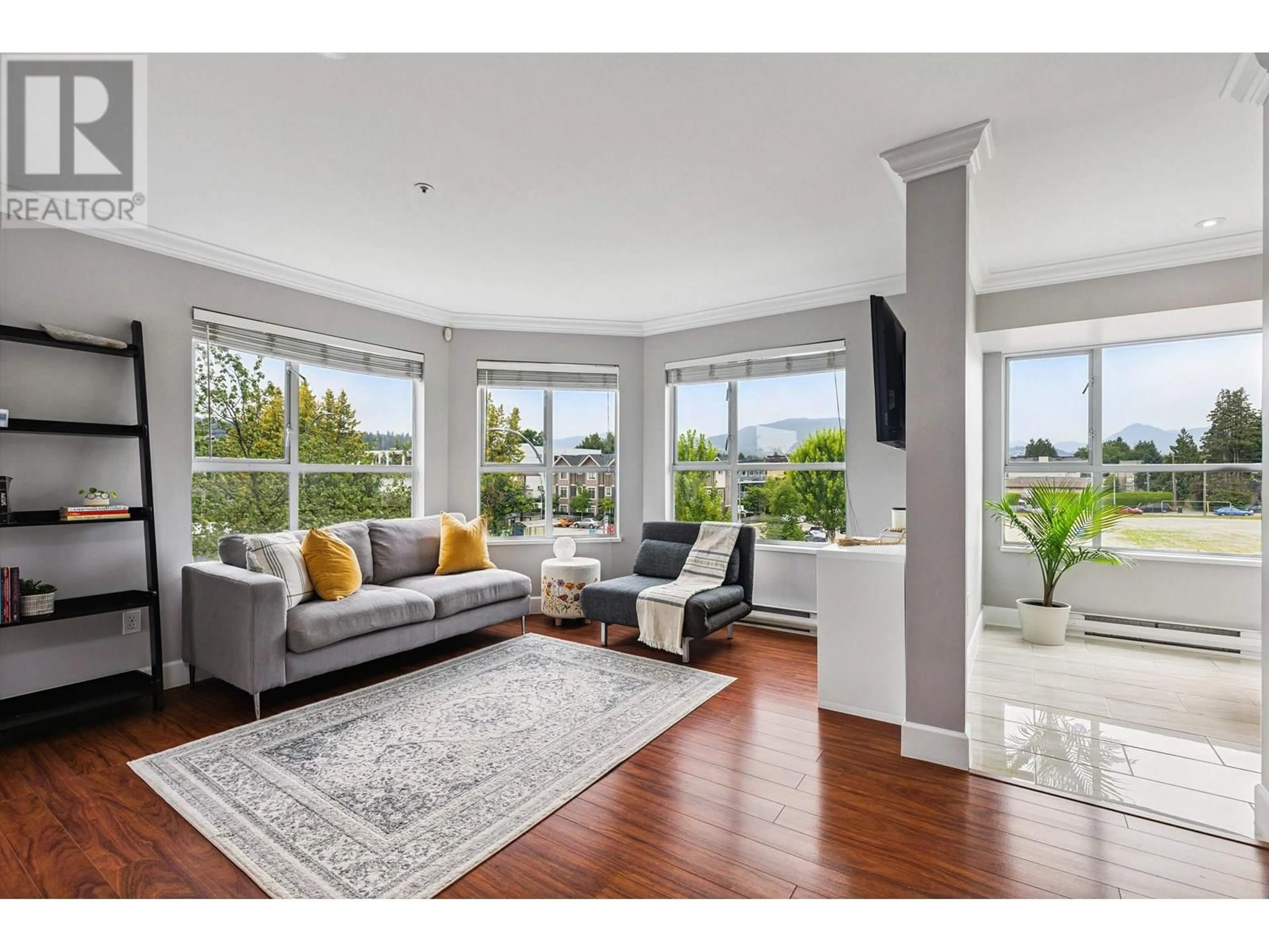 Living room with furniture, unknown for 203 - 2285 PITT RIVER ROAD, Port Coquitlam British Columbia V3C1R7