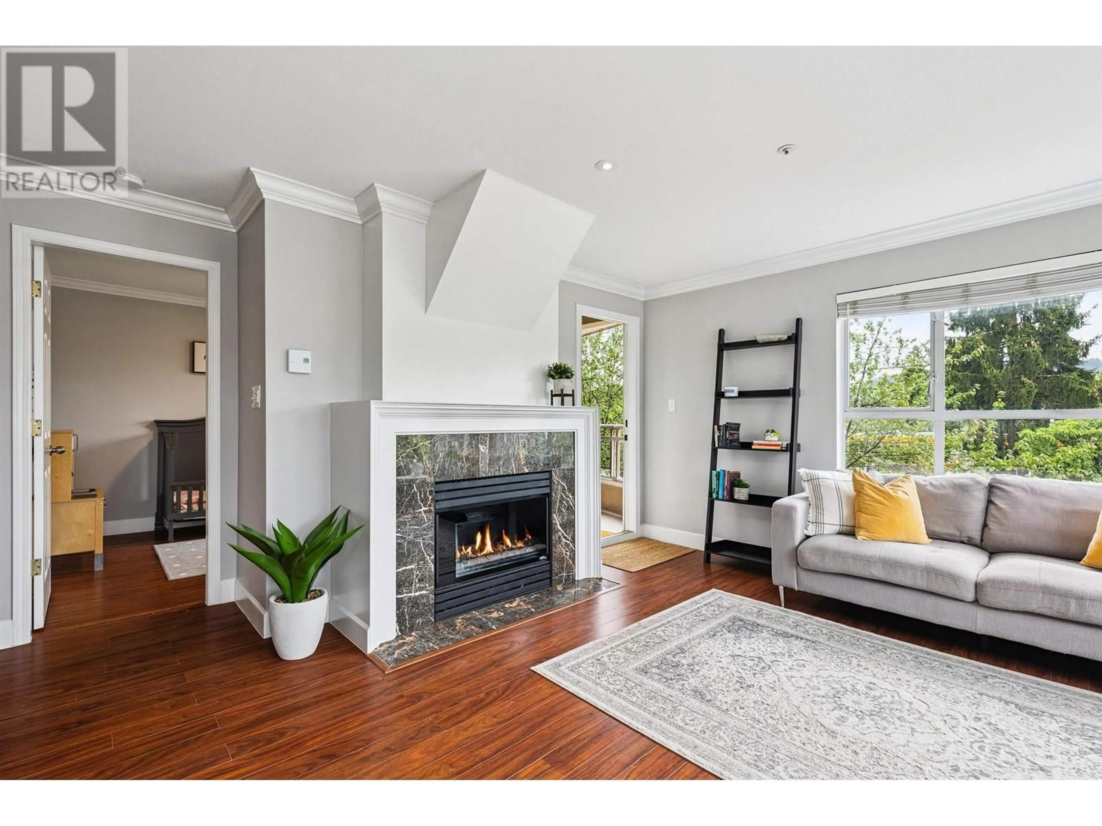 Living room with furniture, unknown for 203 - 2285 PITT RIVER ROAD, Port Coquitlam British Columbia V3C1R7