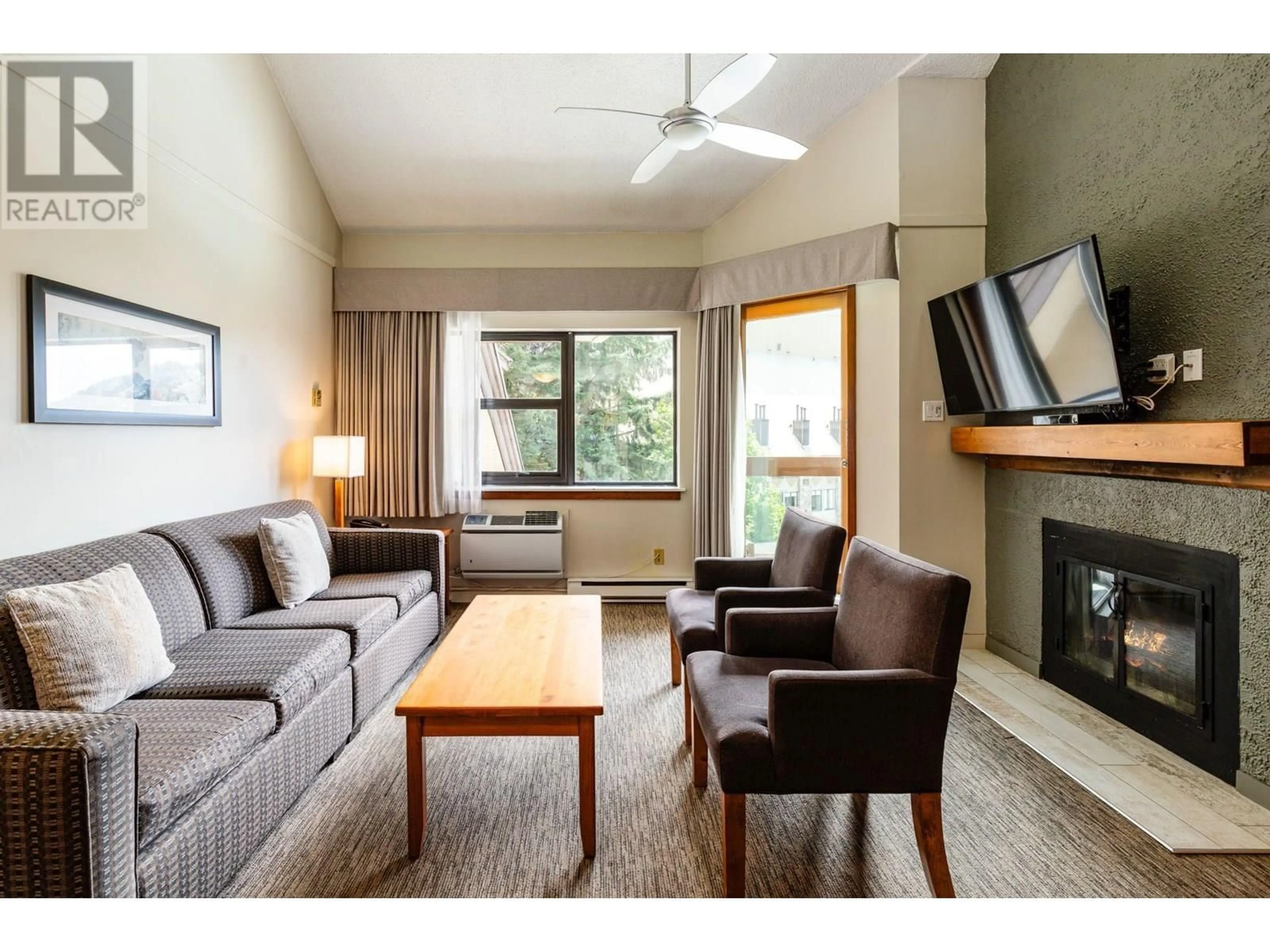Living room with furniture, wood/laminate floor for 362 - 4429 SUNDIAL PLACE, Whistler British Columbia V8E1G8