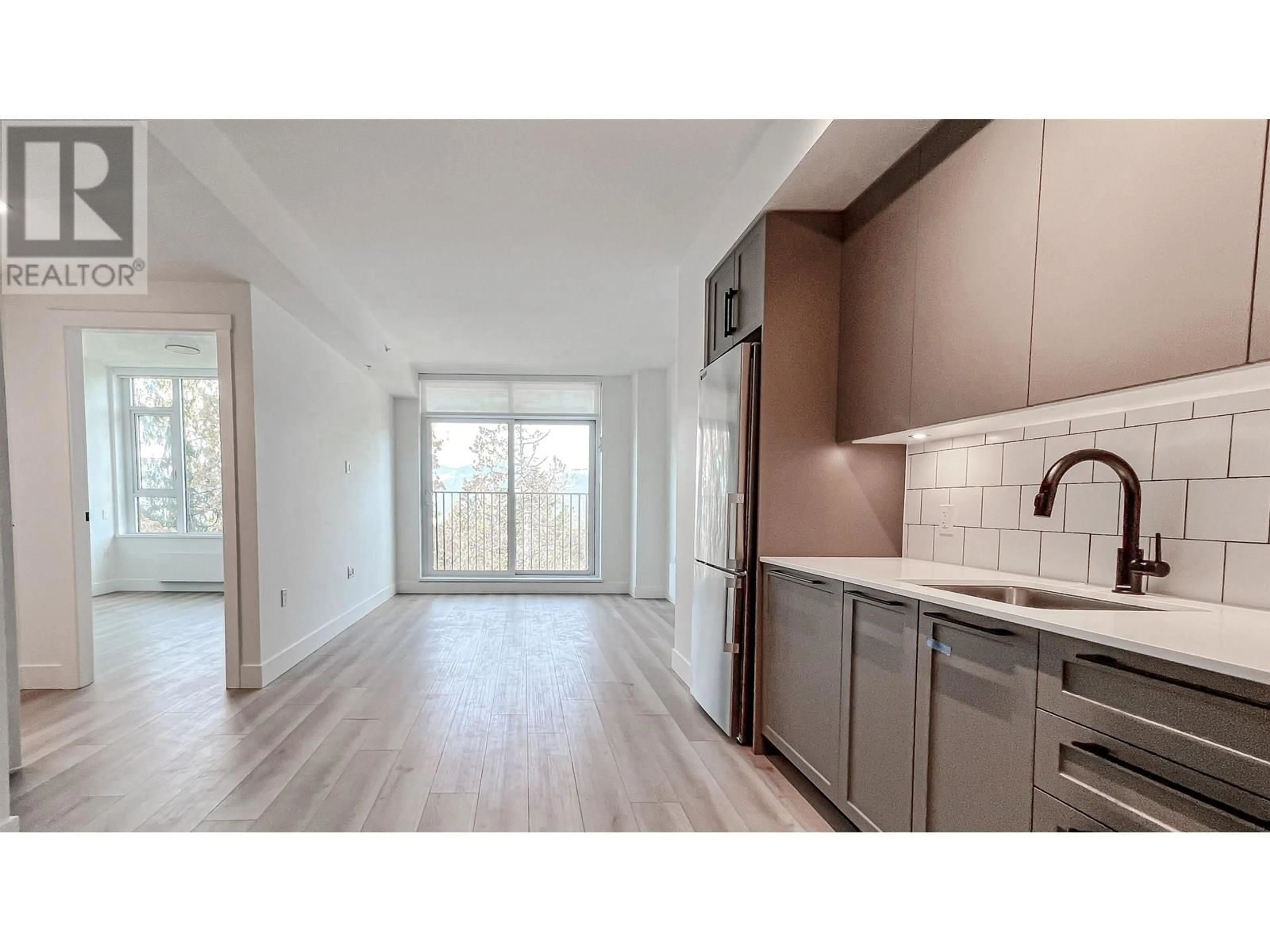 Open concept kitchen, wood/laminate floor for 705 - 8750 UNIVERSITY CRESCENT, Burnaby British Columbia V5A0G9