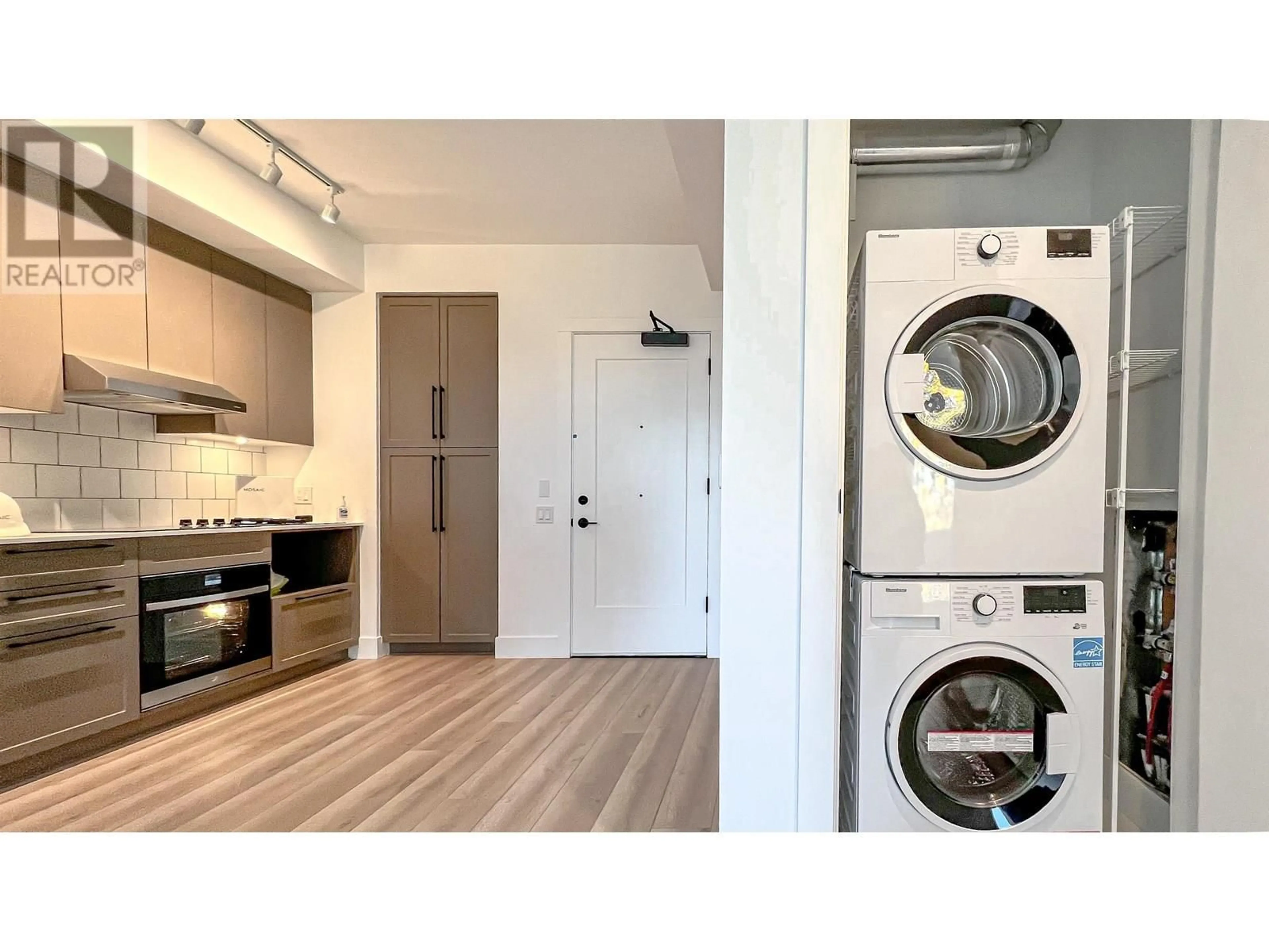 Kitchen with laundary machines, wood/laminate floor for 705 - 8750 UNIVERSITY CRESCENT, Burnaby British Columbia V5A0G9