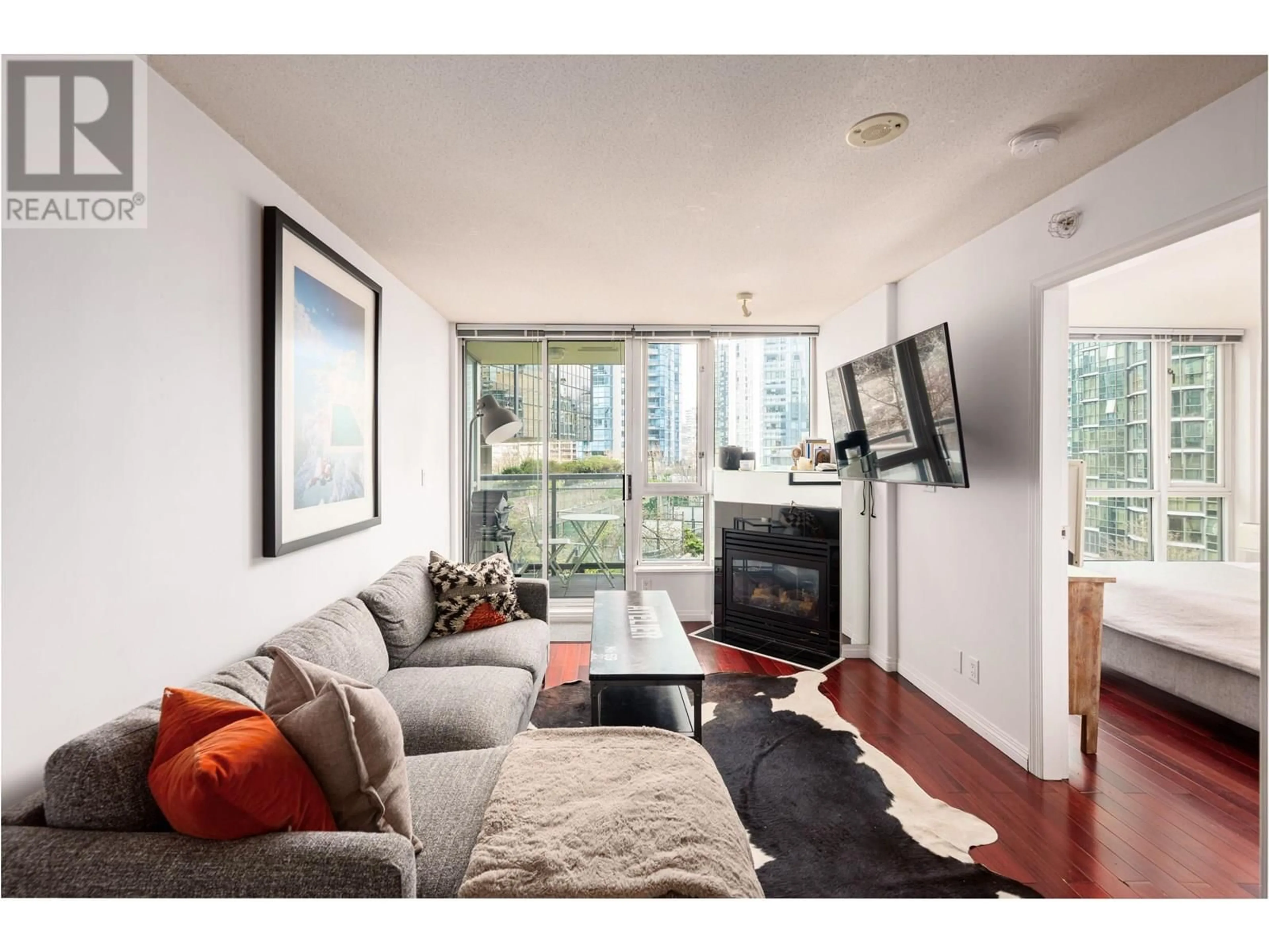 Living room with furniture, wood/laminate floor for 604 - 1328 PENDER STREET, Vancouver British Columbia V6E4T1