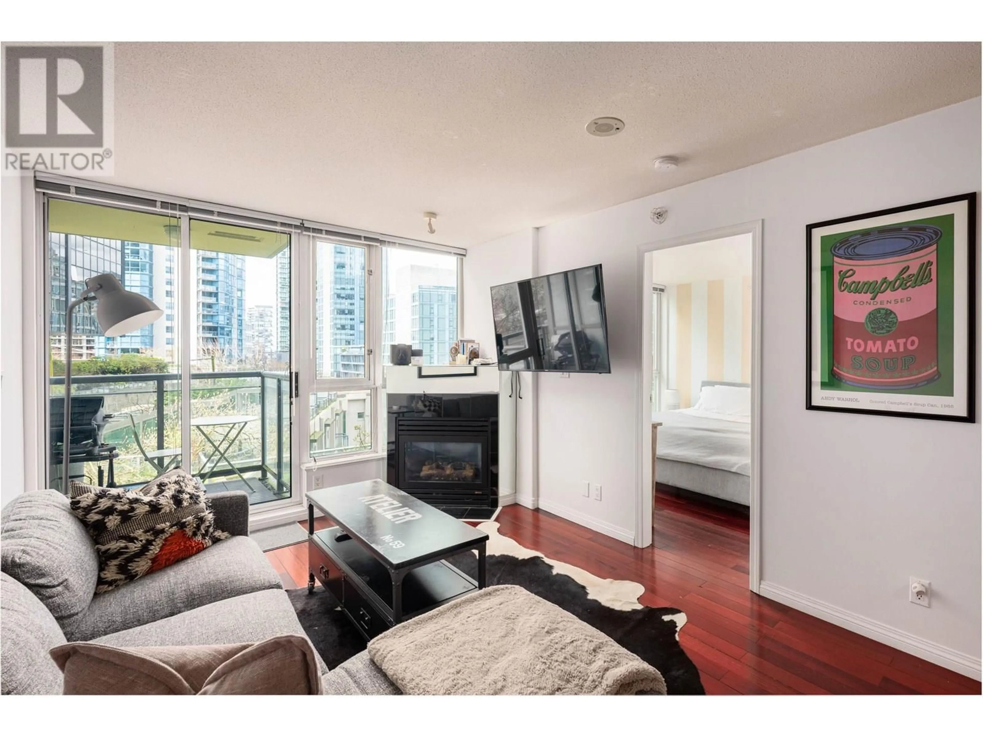 Living room with furniture, wood/laminate floor for 604 - 1328 PENDER STREET, Vancouver British Columbia V6E4T1