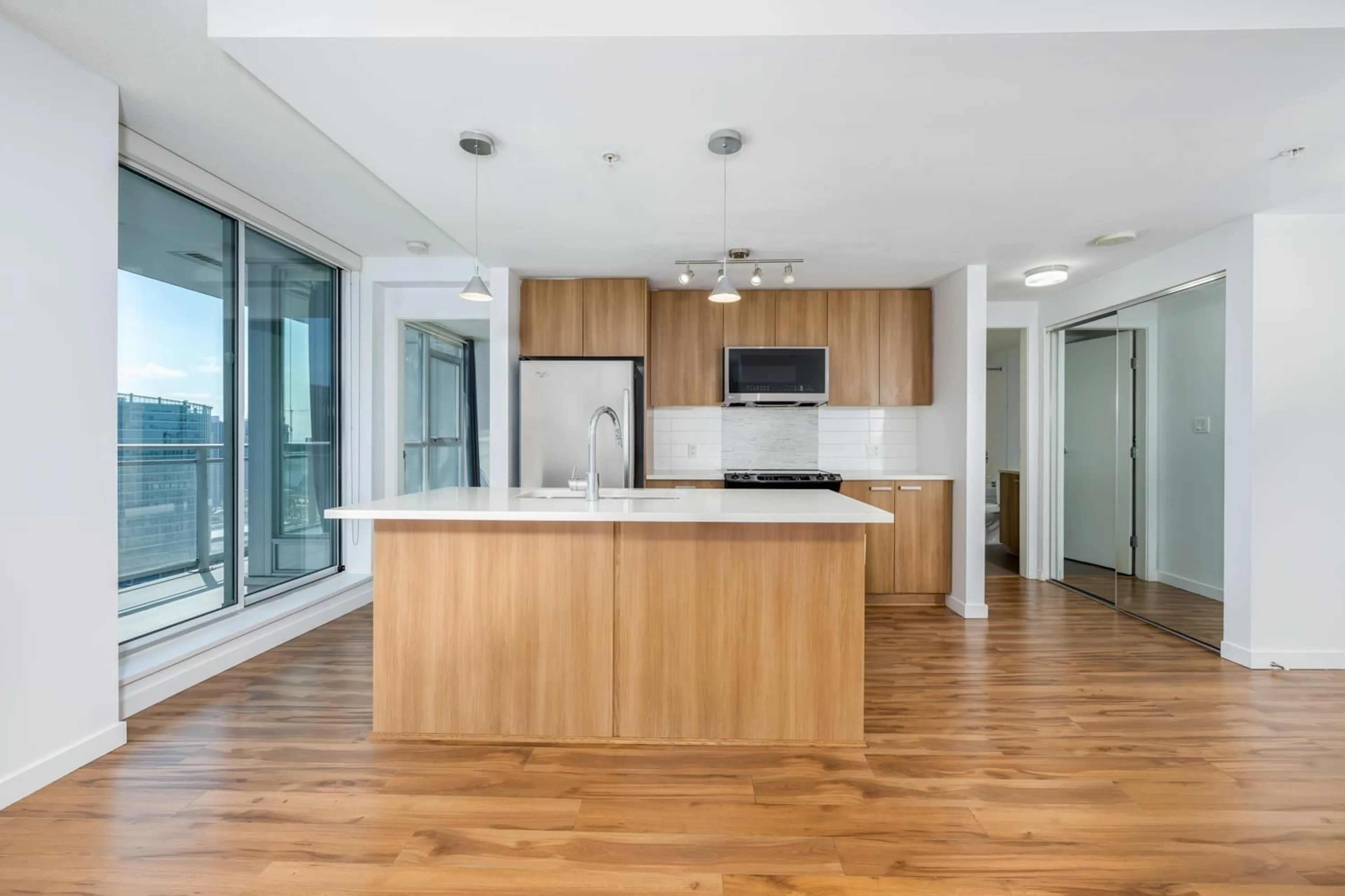 Open concept kitchen, wood/laminate floor for 3305 - 13325 102A, Surrey British Columbia V3T0J5