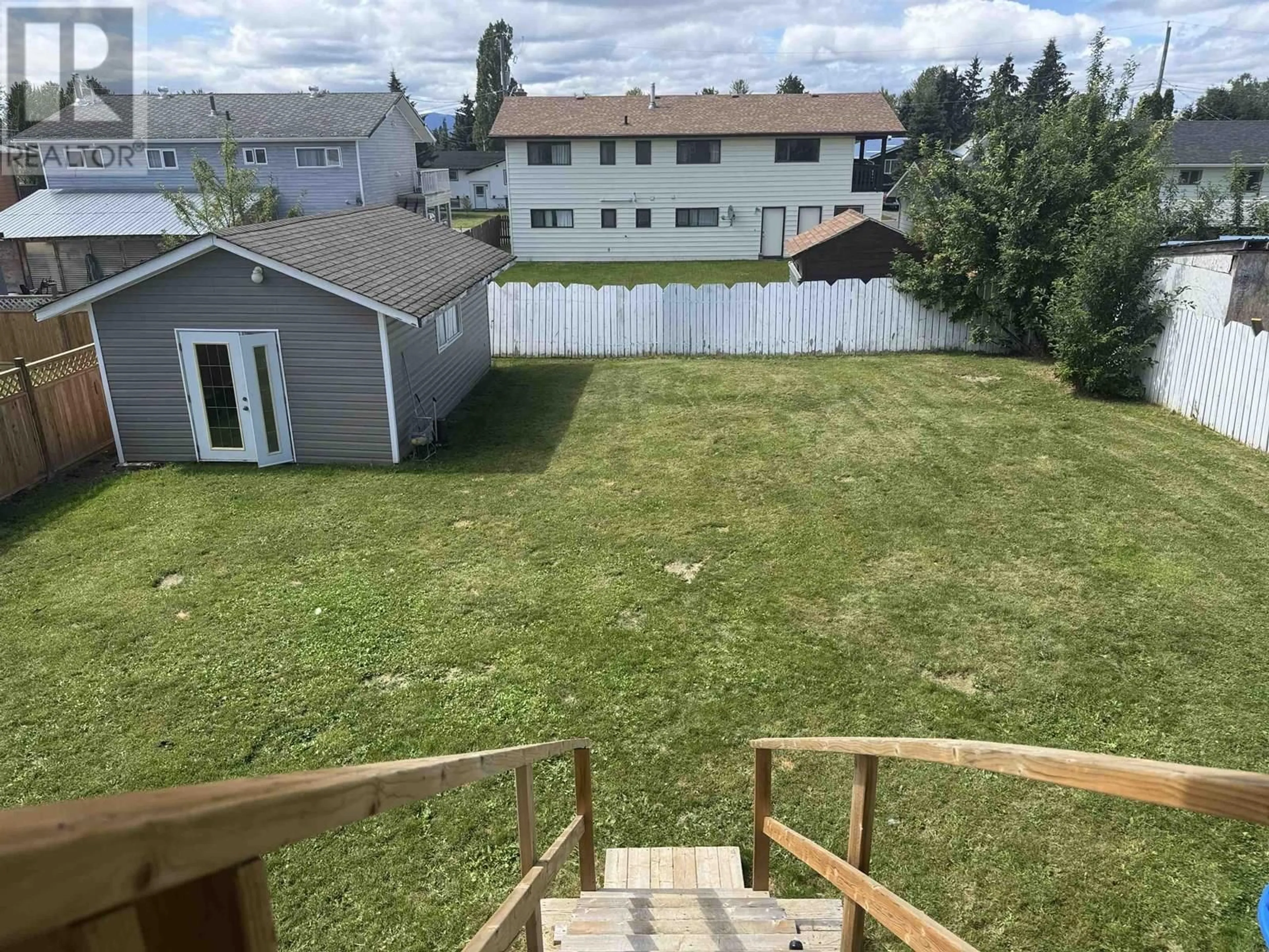A pic from outside/outdoor area/front of a property/back of a property/a pic from drone, mountain view for 519 BABINE DRIVE, Mackenzie British Columbia V0J2C0