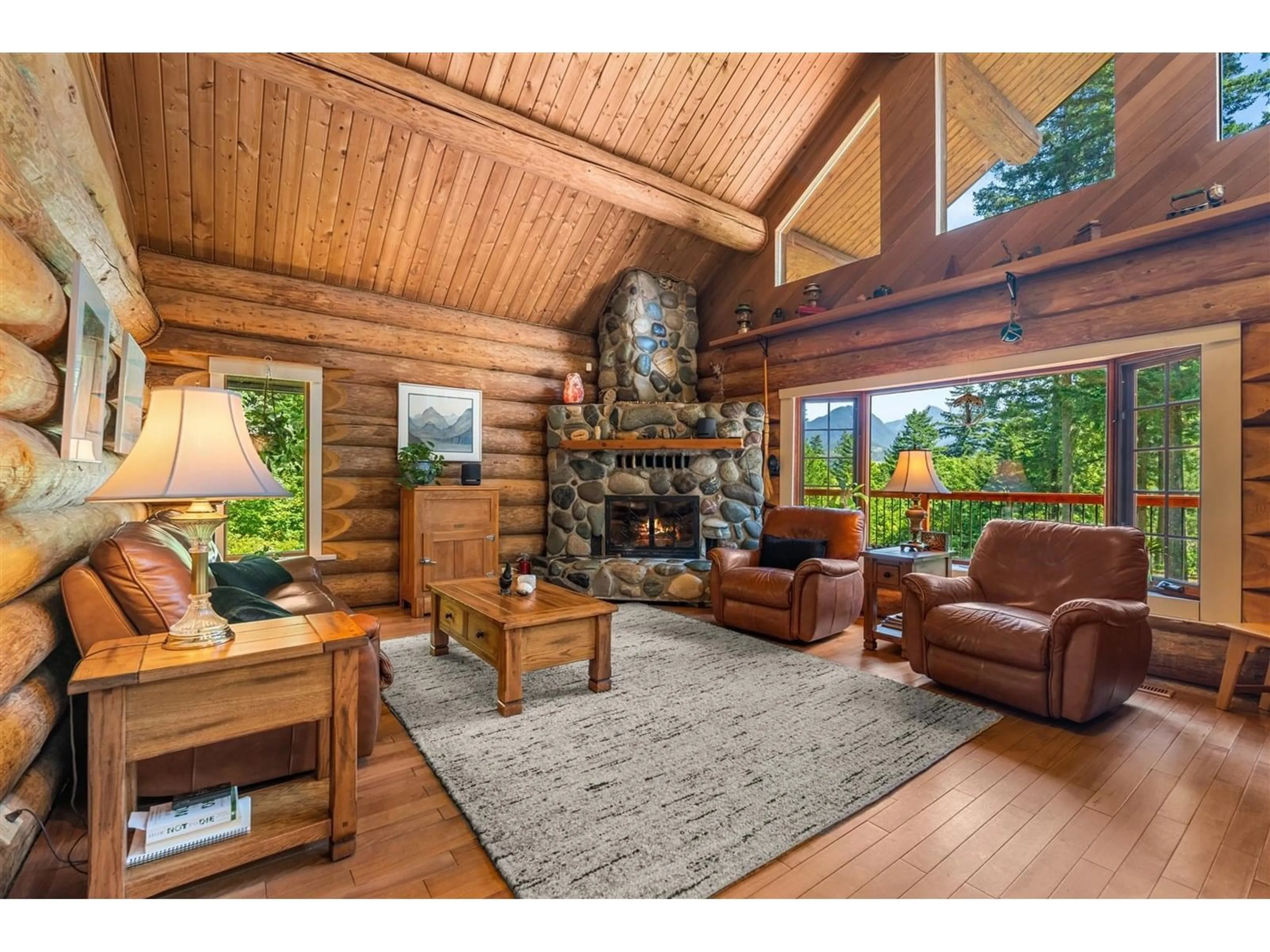 Living room with furniture, wood/laminate floor for 21360 LANDSTROM ROAD, Hope British Columbia V0X1L3