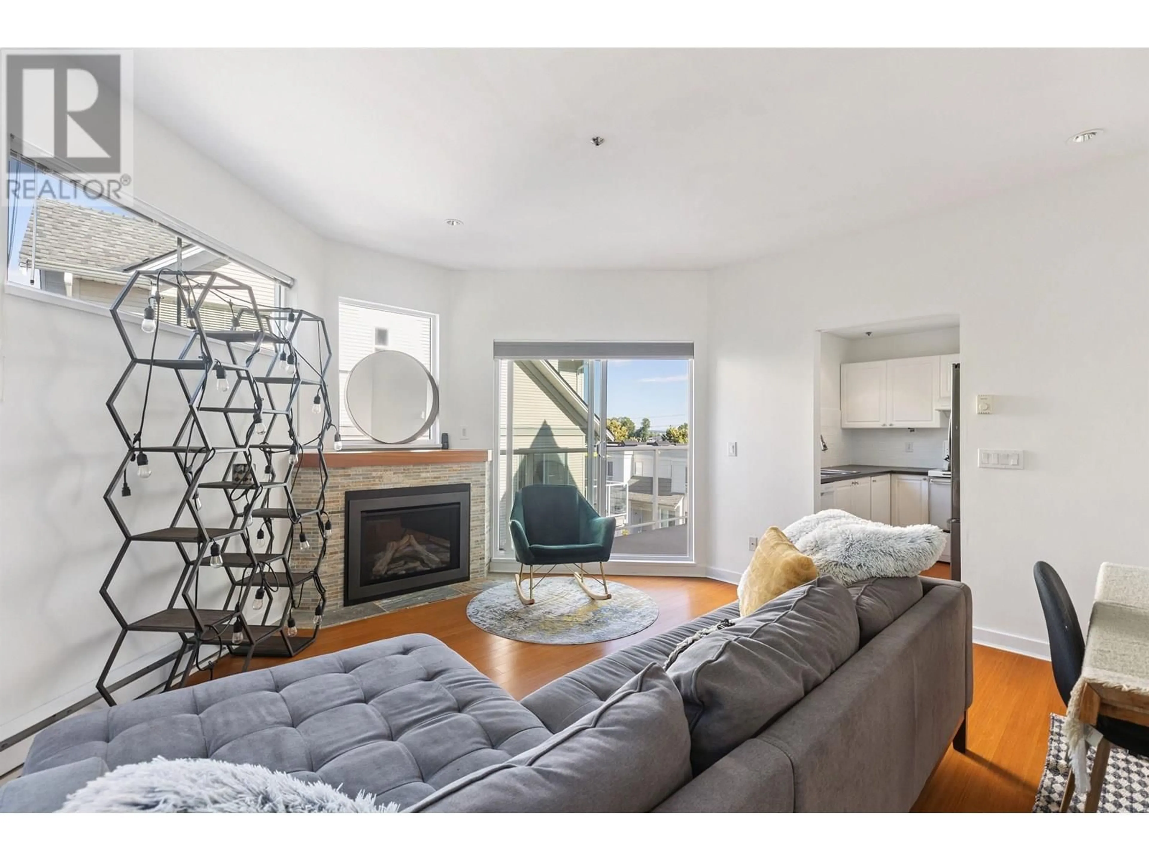 Living room with furniture, wood/laminate floor for 22 - 2713 KENT AVENUE NORTH, Vancouver British Columbia V5S3T9