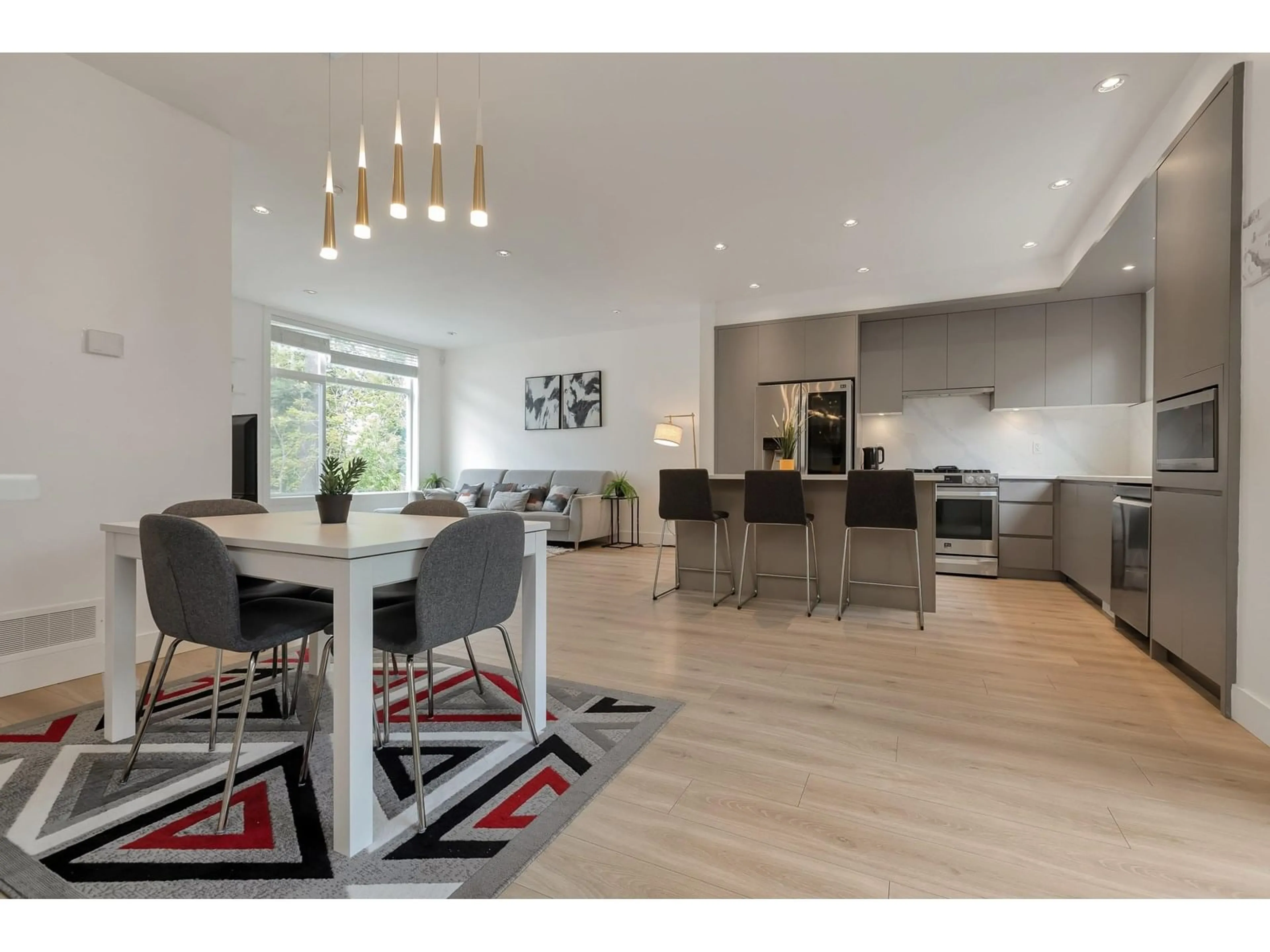 Open concept kitchen, wood/laminate floor for 9 - 2328 167A, Surrey British Columbia V3Z1H2