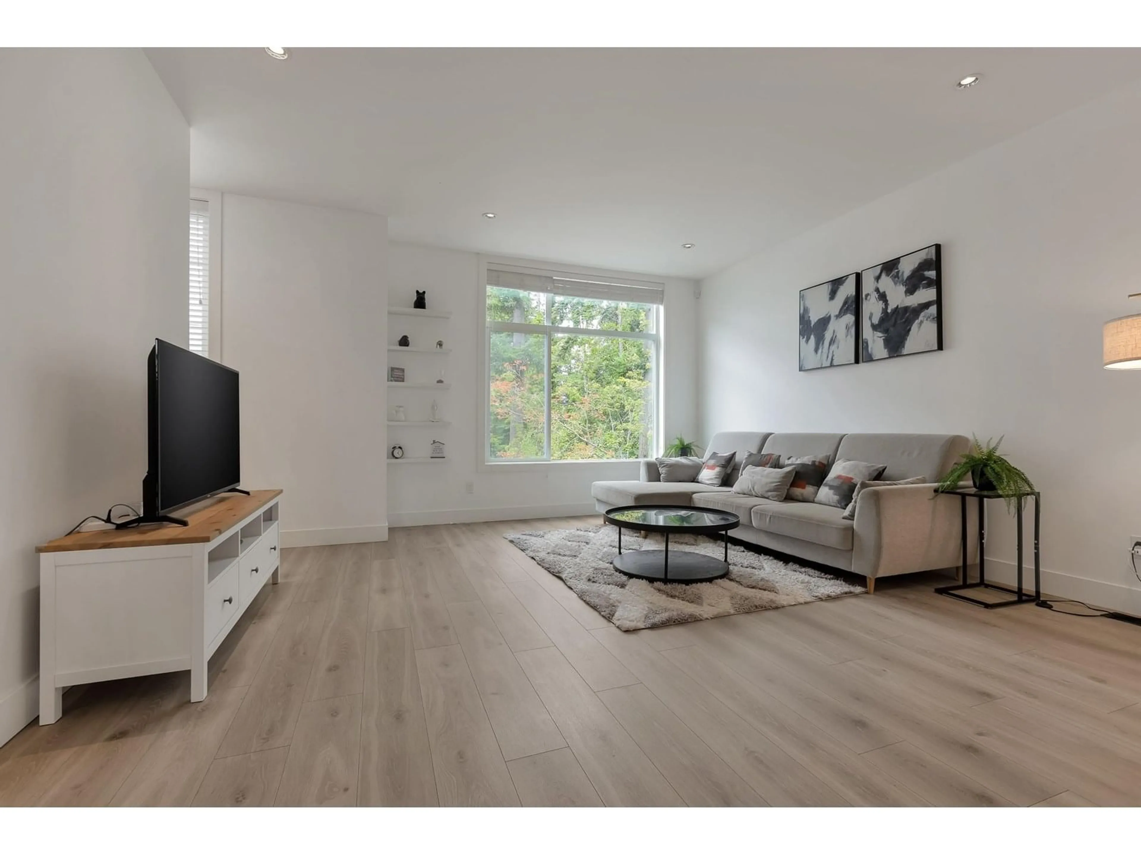 Living room with furniture, wood/laminate floor for 9 - 2328 167A, Surrey British Columbia V3Z1H2