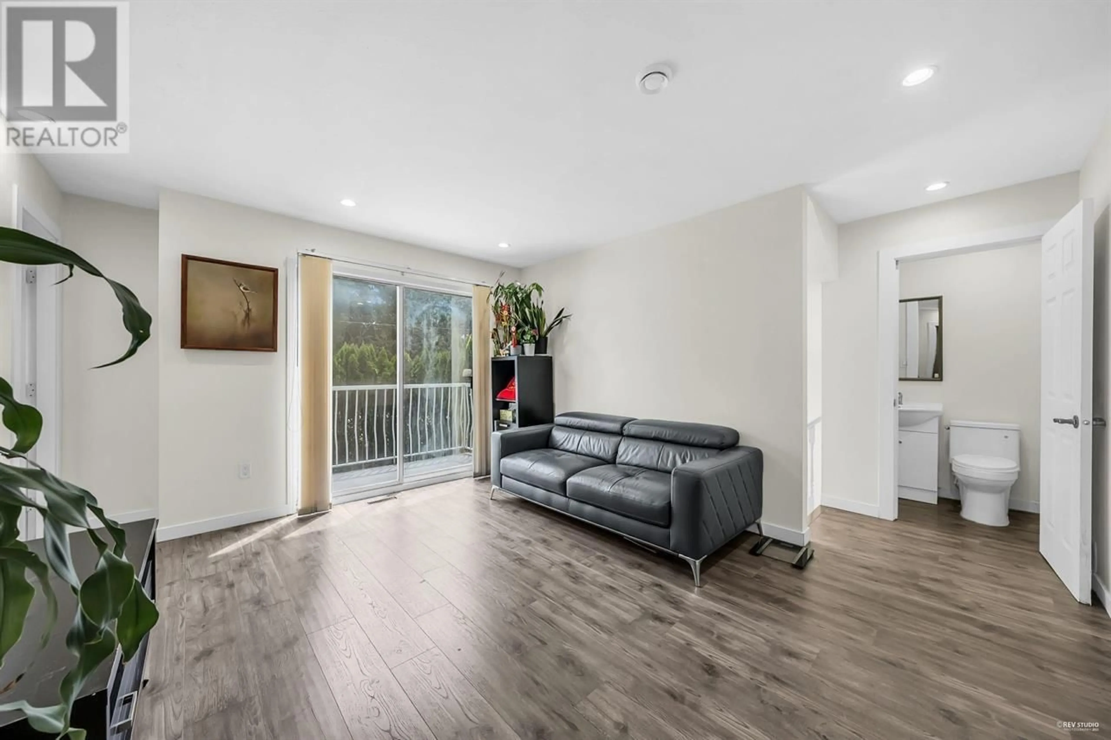 Living room with furniture, wood/laminate floor for 7549 10TH AVENUE, Burnaby British Columbia V3N2S1