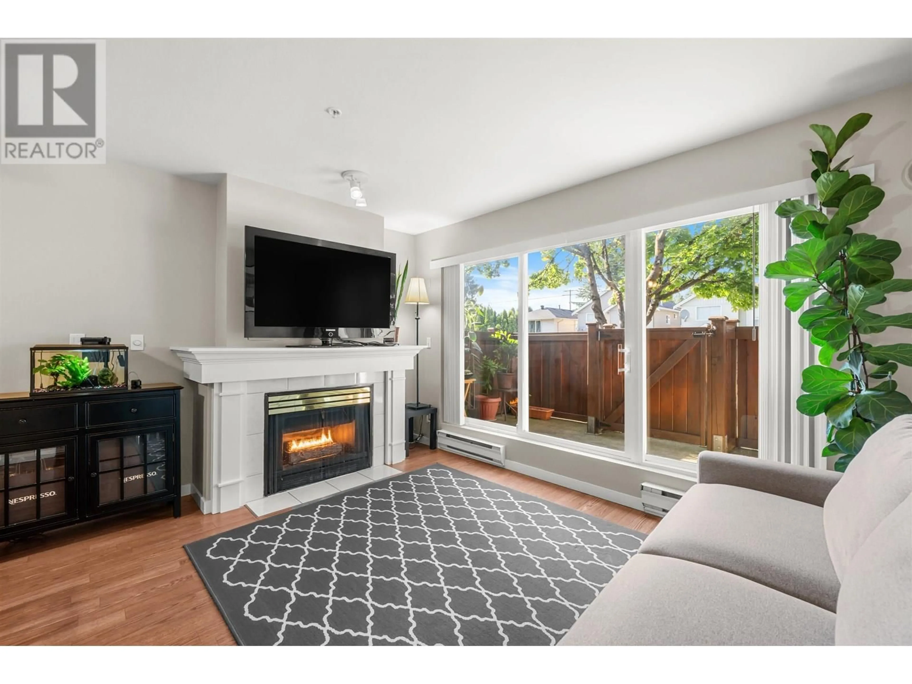 Living room with furniture, unknown for 102 - 1570 PRAIRIE AVENUE, Port Coquitlam British Columbia V3B1T4