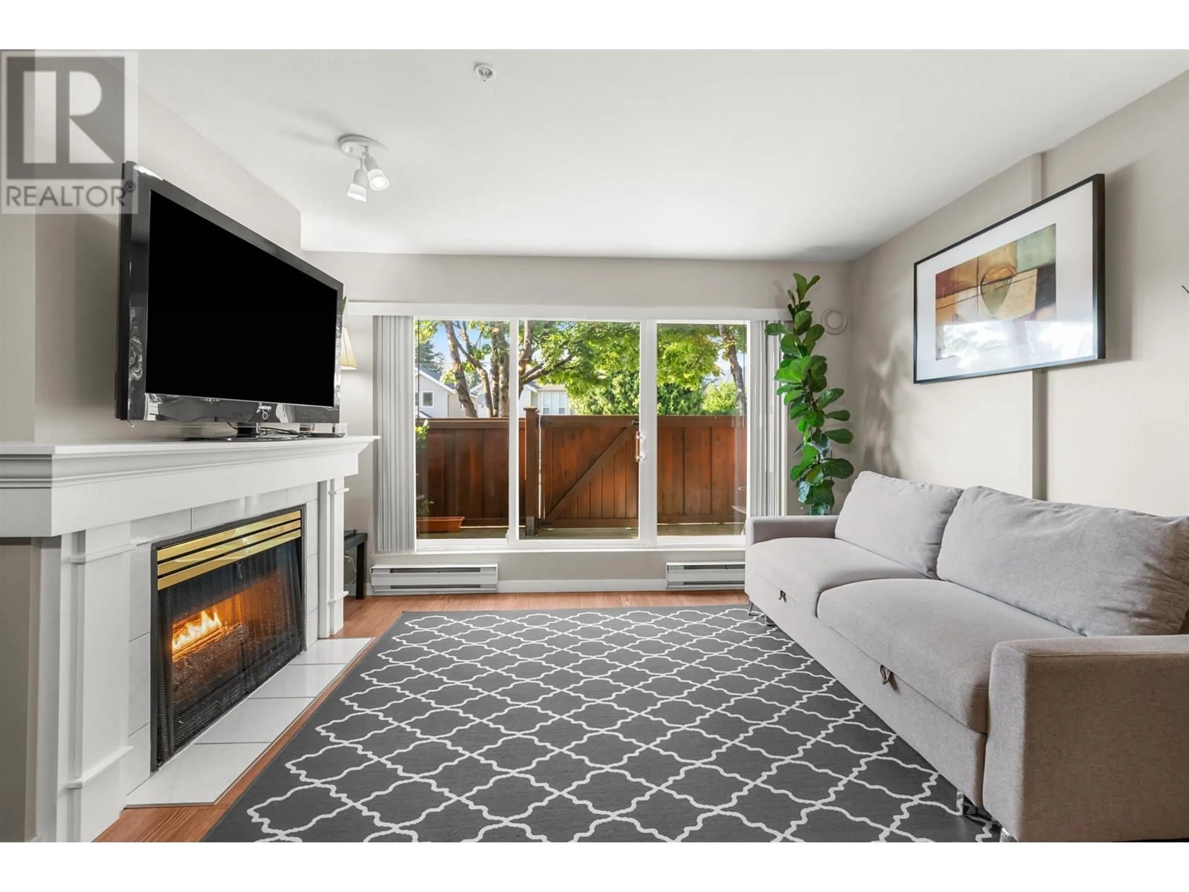 Living room with furniture, unknown for 102 - 1570 PRAIRIE AVENUE, Port Coquitlam British Columbia V3B1T4