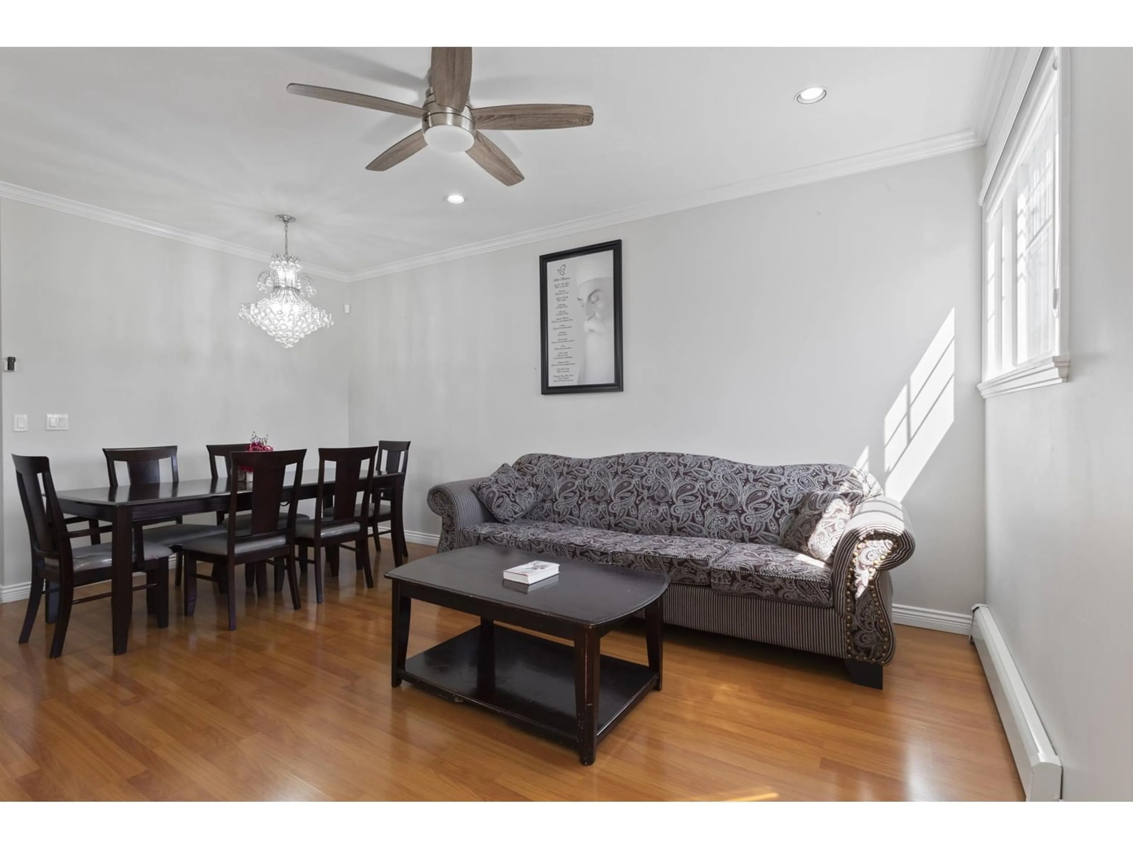 Living room with furniture, wood/laminate floor for 6453 141A, Surrey British Columbia V3W1R5