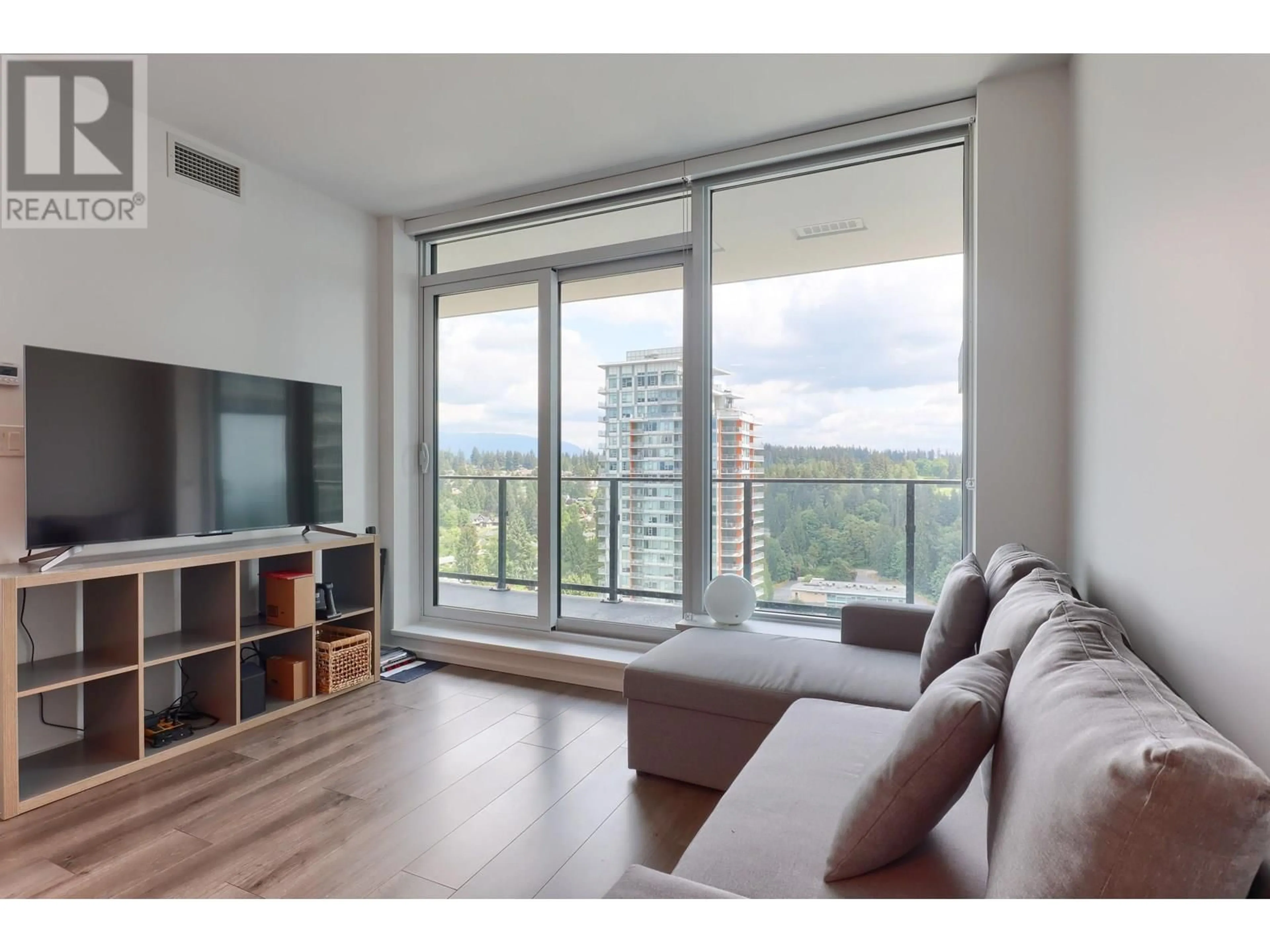 Living room with furniture, wood/laminate floor for 2304 - 3809 EVERGREEN PLACE, Burnaby British Columbia V3J0M1