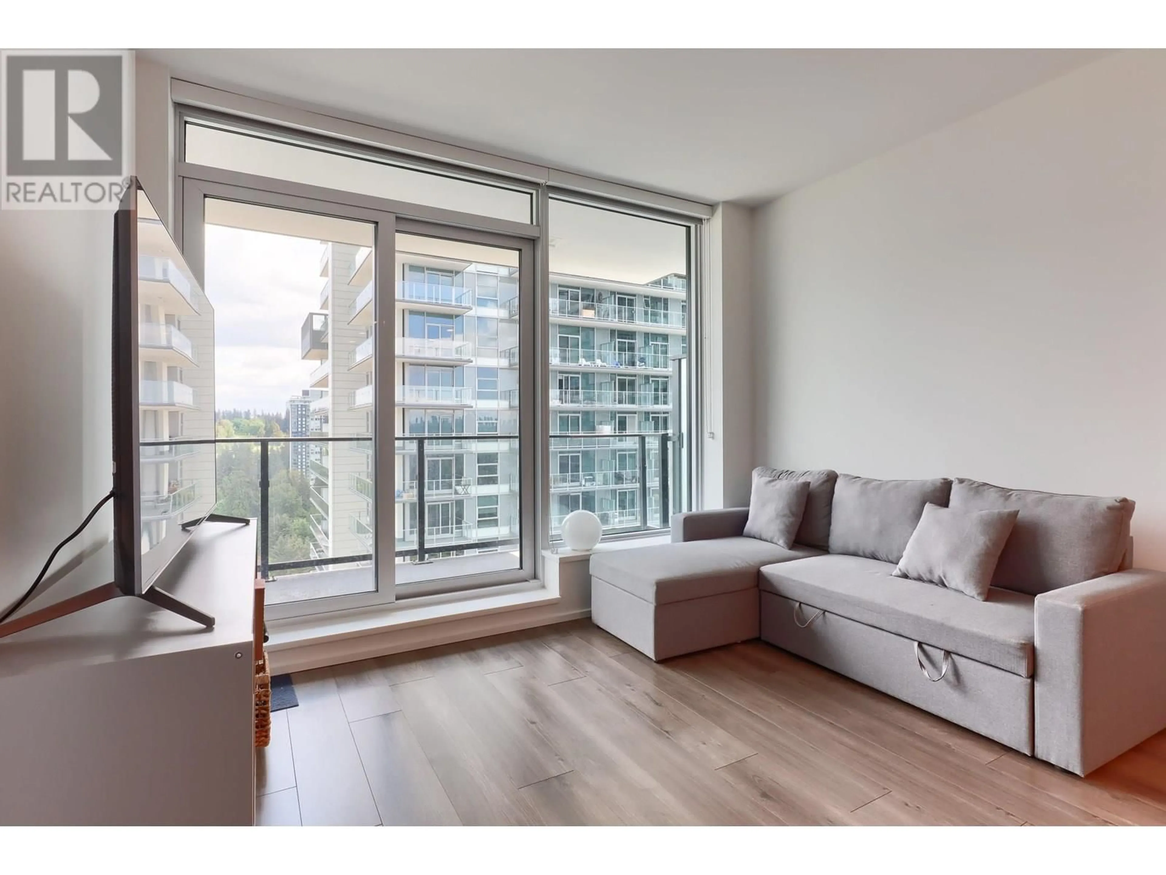 Living room with furniture, wood/laminate floor for 2304 - 3809 EVERGREEN PLACE, Burnaby British Columbia V3J0M1