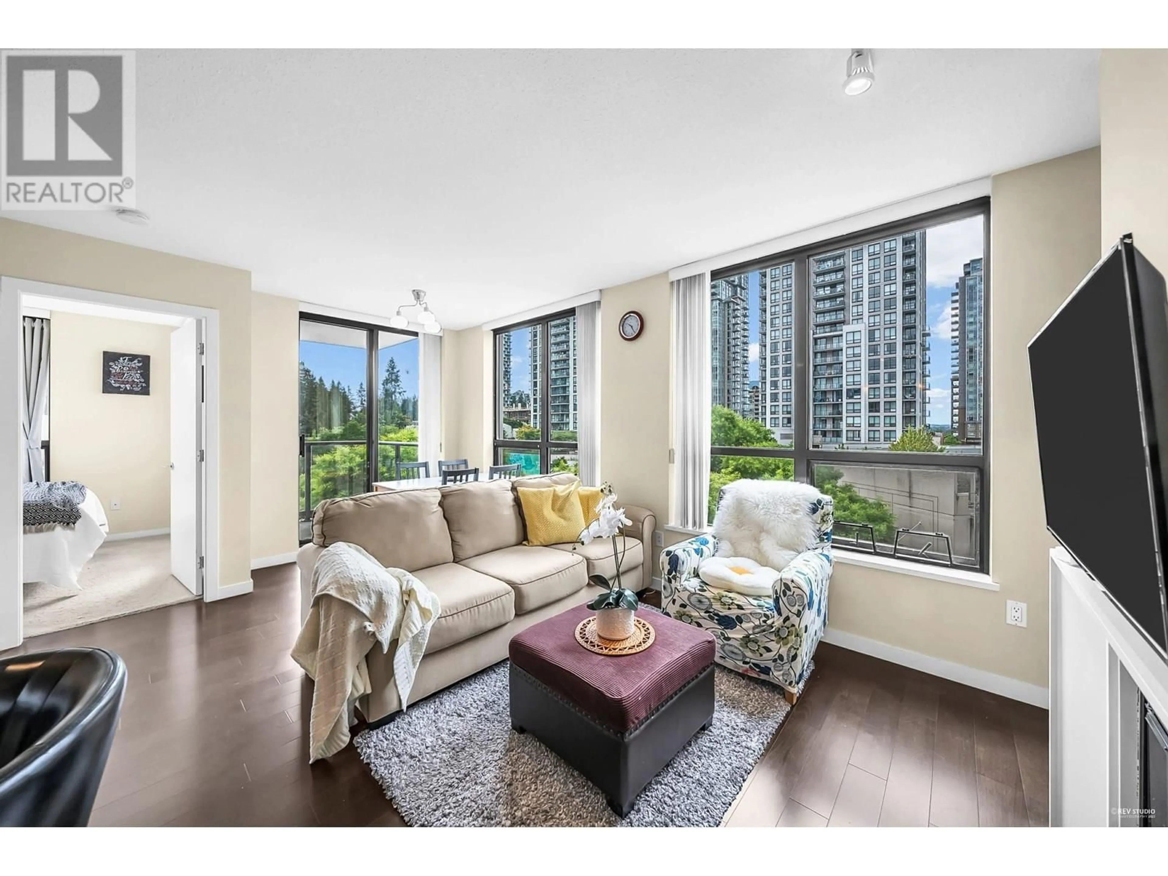 Living room with furniture, wood/laminate floor for 609 - 2982 BURLINGTON DRIVE, Coquitlam British Columbia V3B0B3
