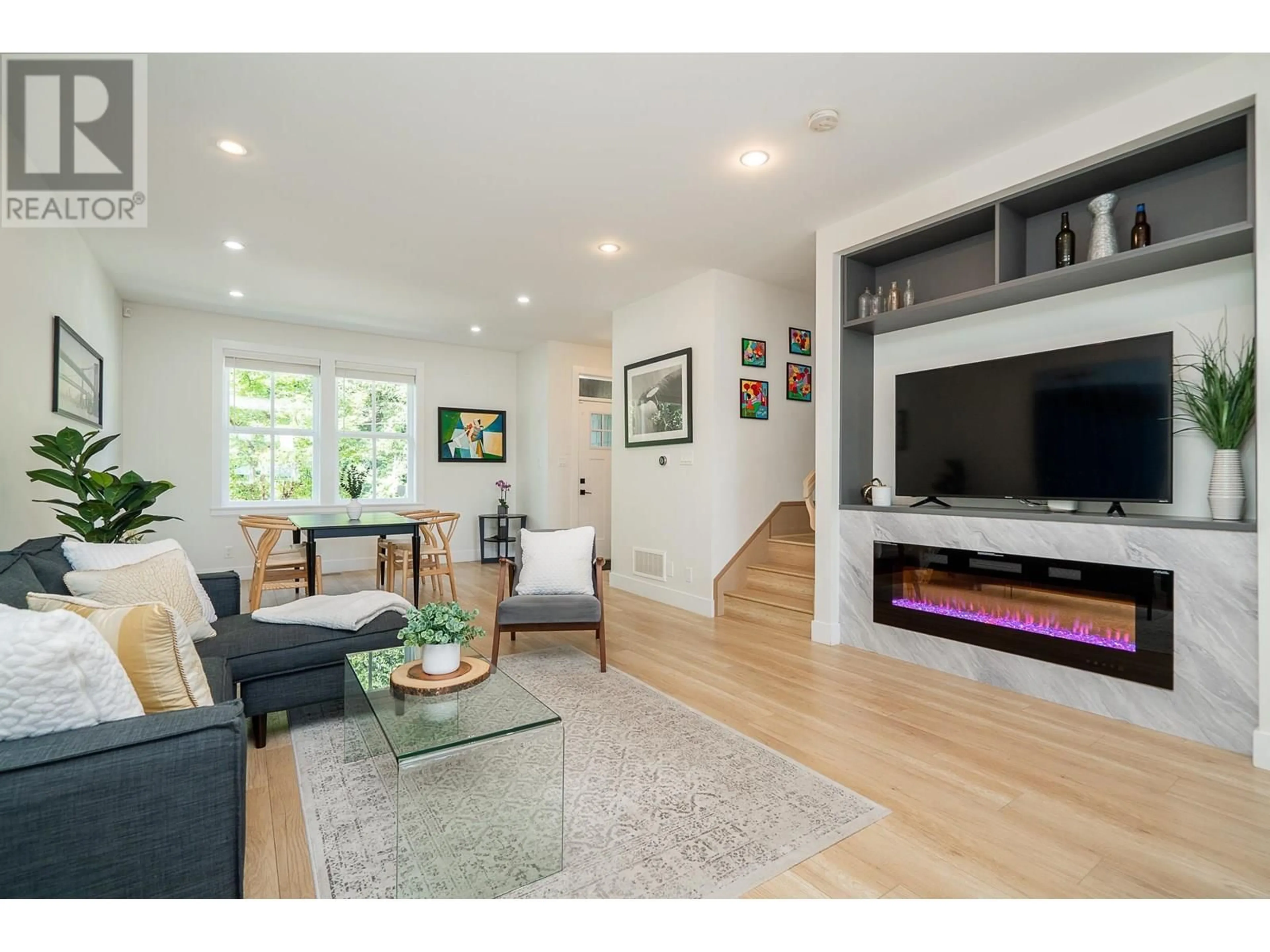 Living room with furniture, wood/laminate floor for 107 - 3416 QUEENSTON AVENUE, Coquitlam British Columbia V3E3H1