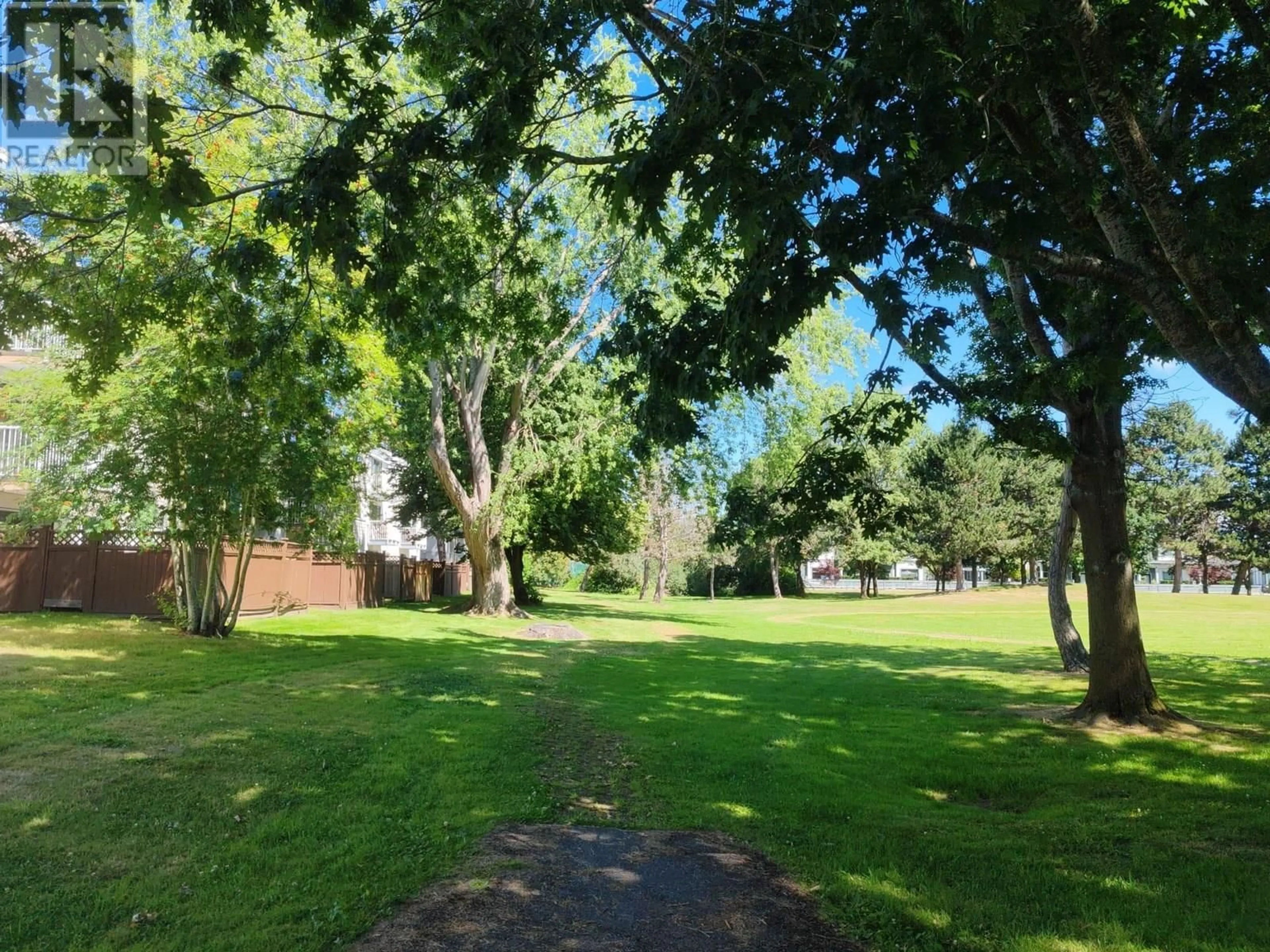 A pic from outside/outdoor area/front of a property/back of a property/a pic from drone, forest/trees view for 204 - 7240 LINDSAY ROAD, Richmond British Columbia V7C3M6