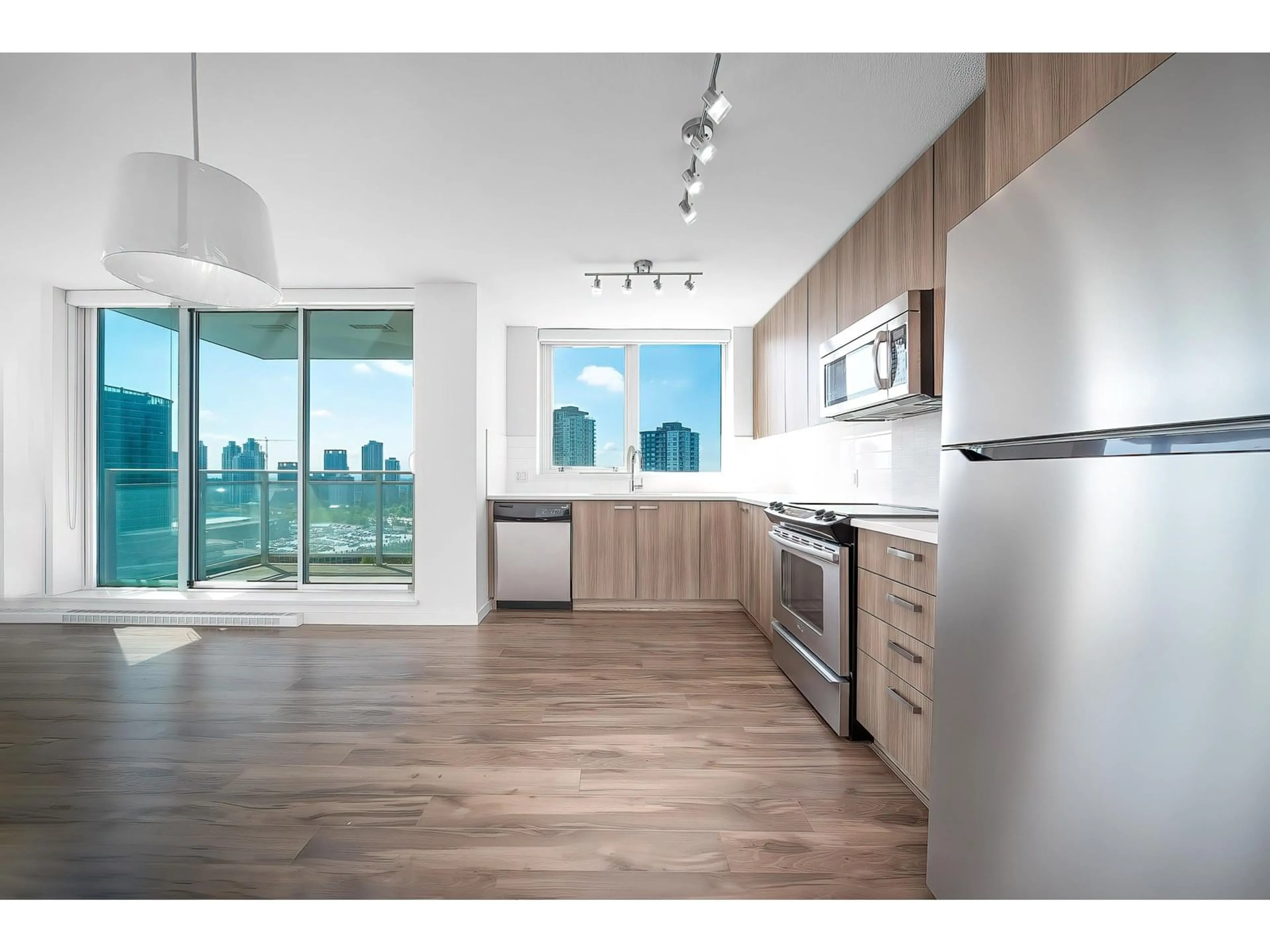 Open concept kitchen, wood/laminate floor for 2309 - 13325 102A, Surrey British Columbia V3T0J5