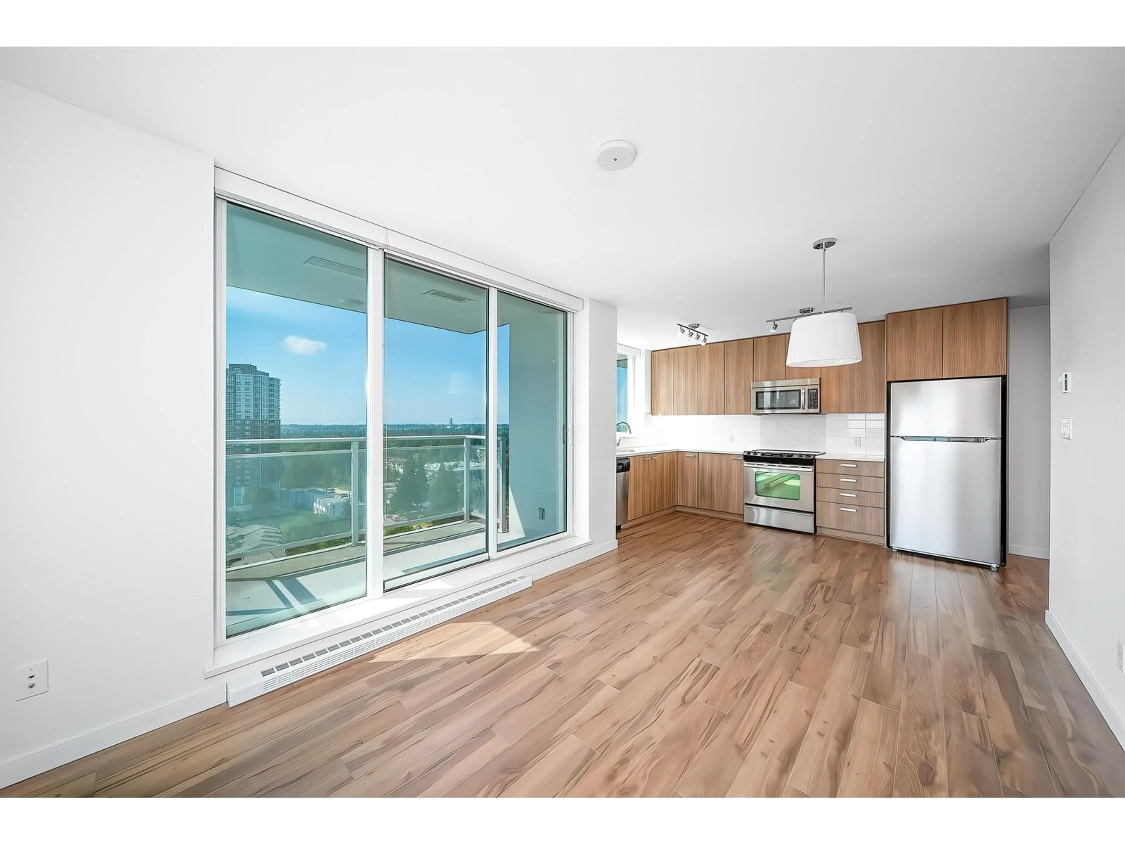 Open concept kitchen, wood/laminate floor for 2309 - 13325 102A, Surrey British Columbia V3T0J5
