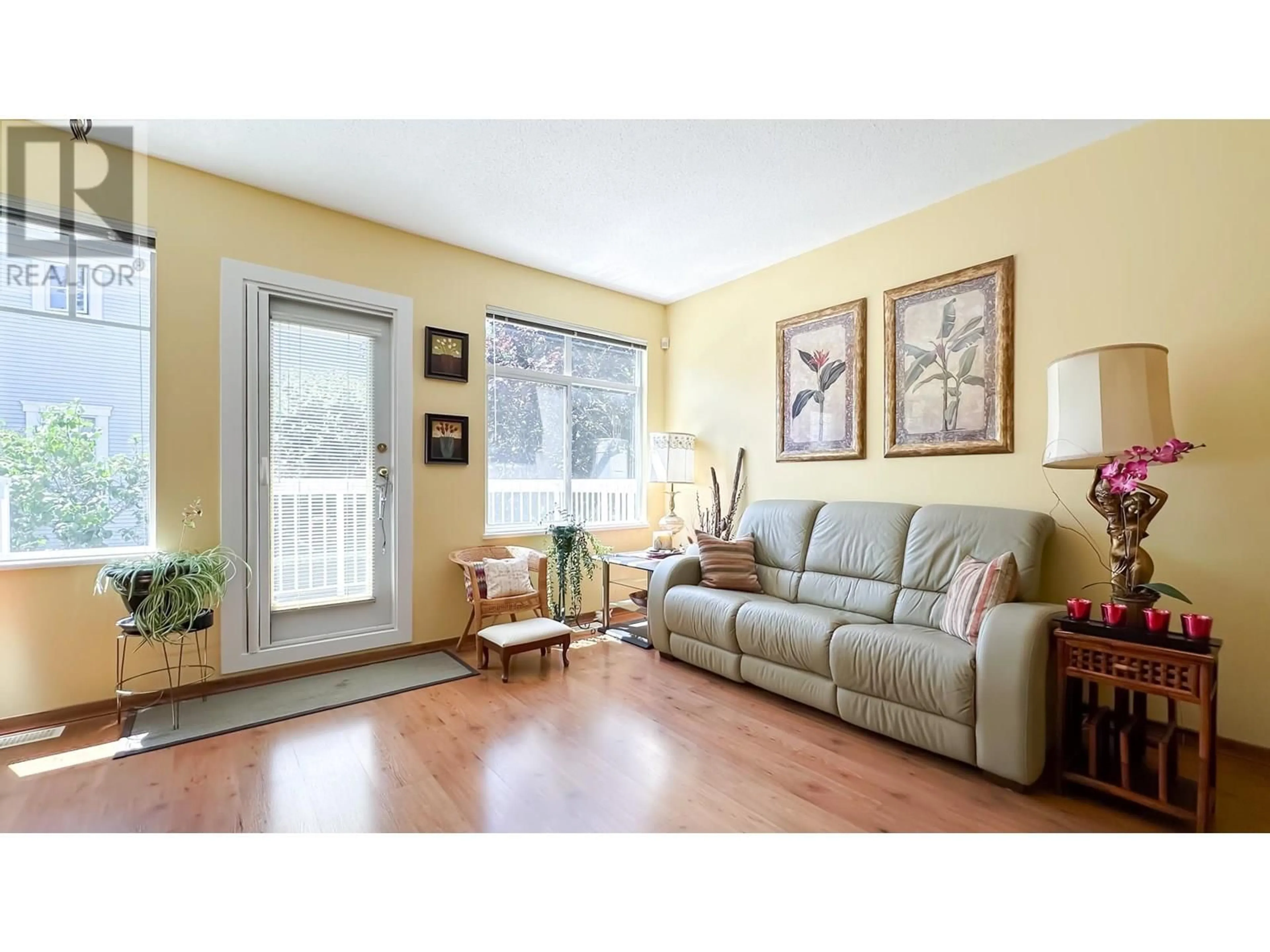 Living room with furniture, wood/laminate floor for 9 - 6331 NO. 1 ROAD, Richmond British Columbia V7C1T4