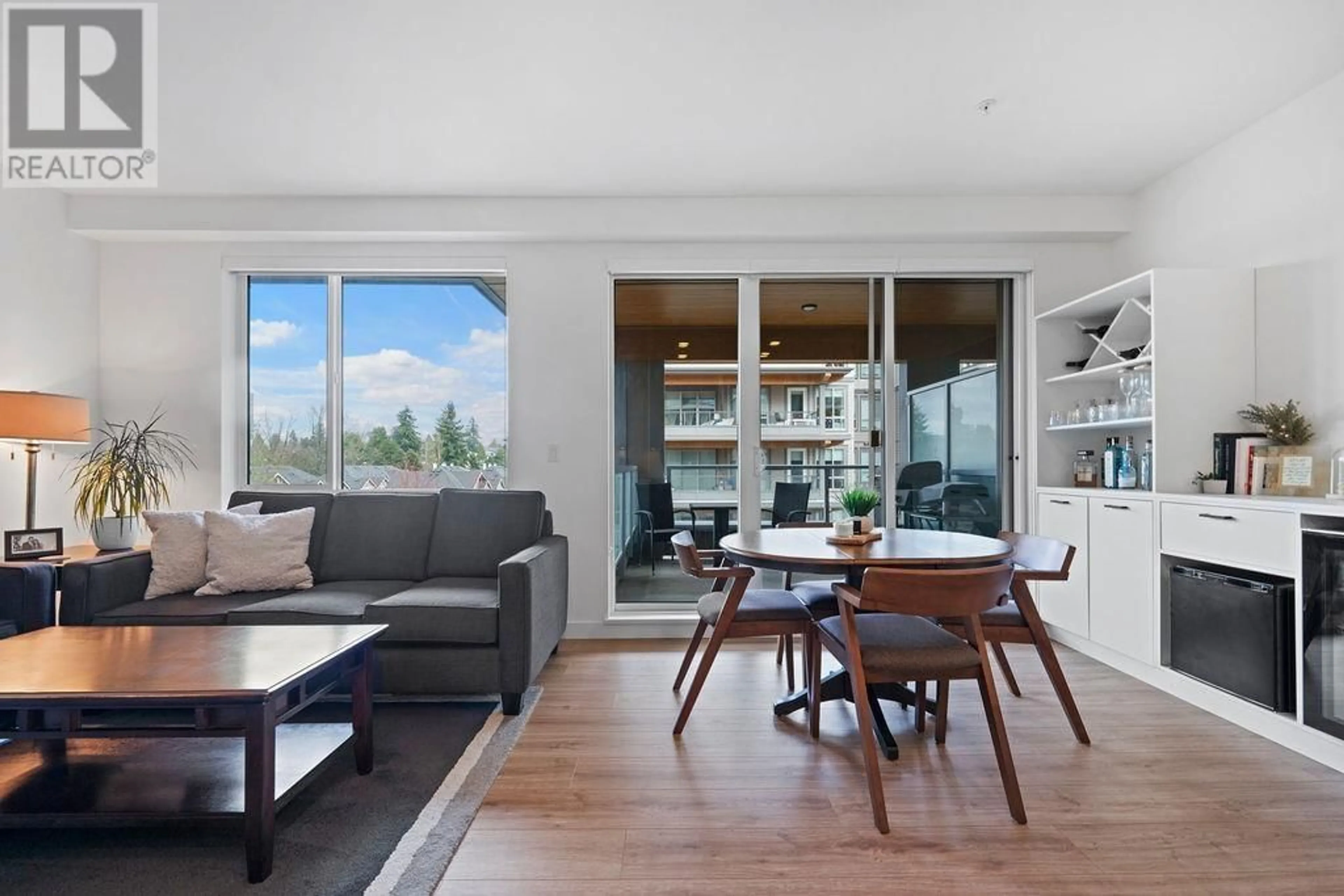 Living room with furniture, wood/laminate floor for 404 - 7133 14TH AVENUE, Burnaby British Columbia V3N0H5