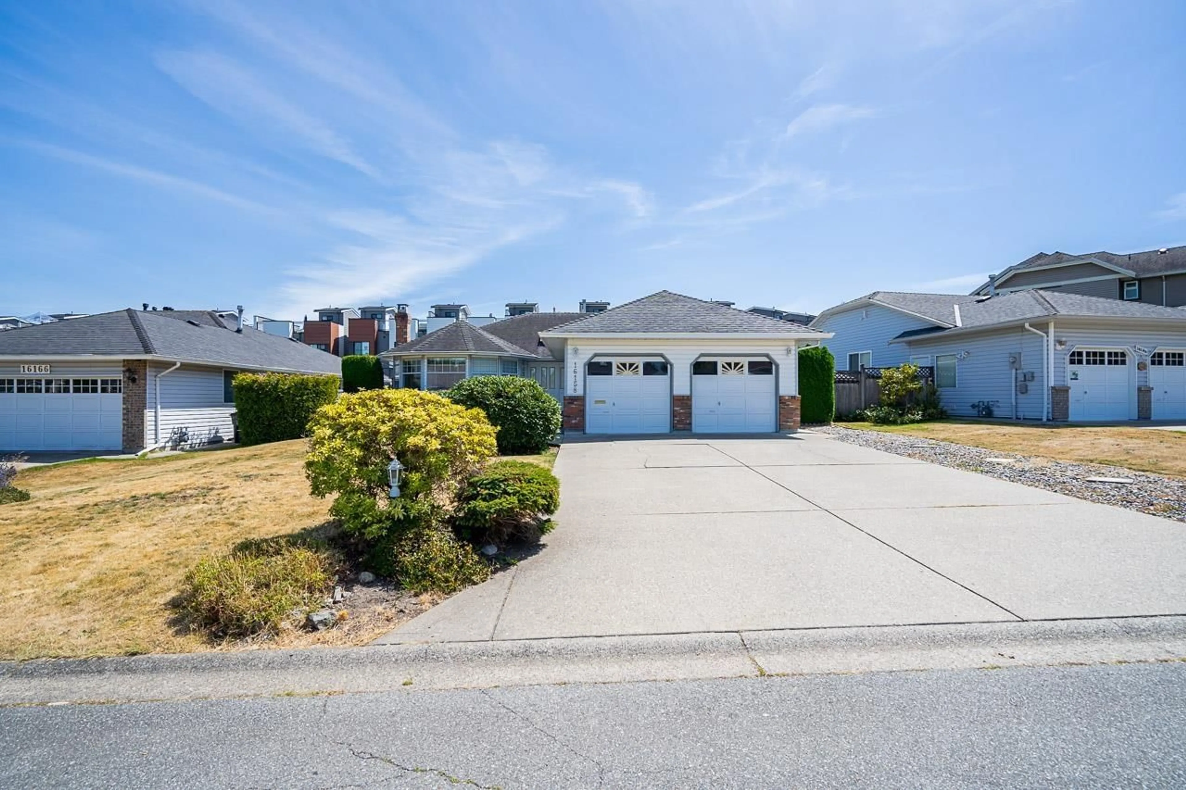 A pic from outside/outdoor area/front of a property/back of a property/a pic from drone, street for 16158 16A, Surrey British Columbia V4A9J9