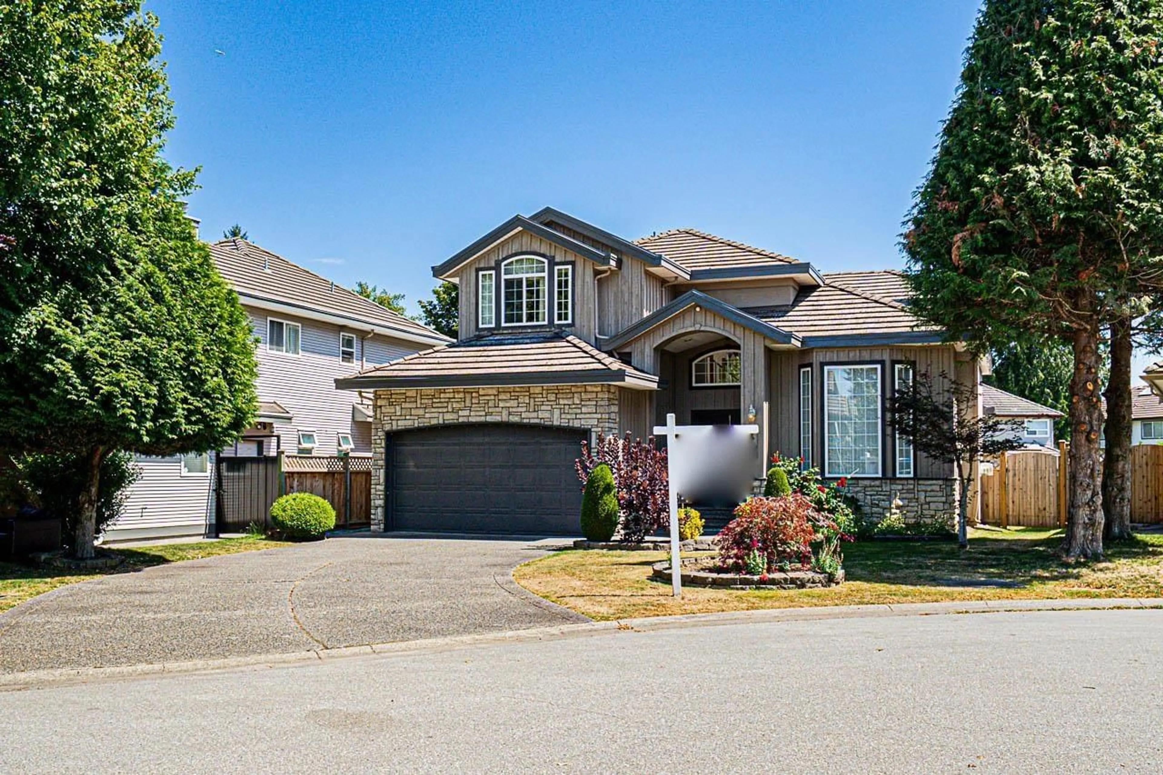 Home with vinyl exterior material, street for 7458 145A, Surrey British Columbia V3S8Z8