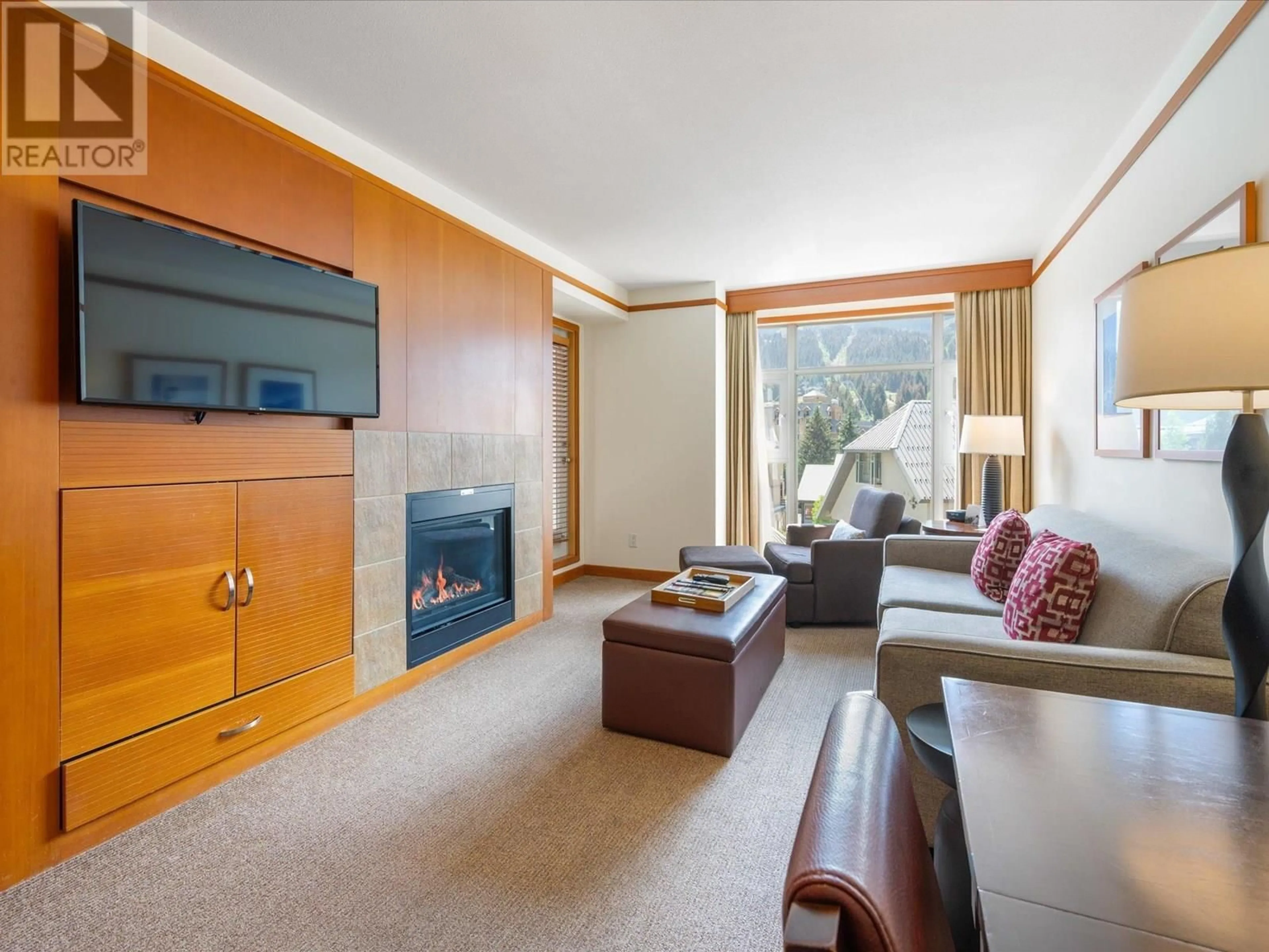 Living room with furniture, wood/laminate floor for 6603 - 4299 BLACKCOMB WAY, Whistler British Columbia V8E0X3