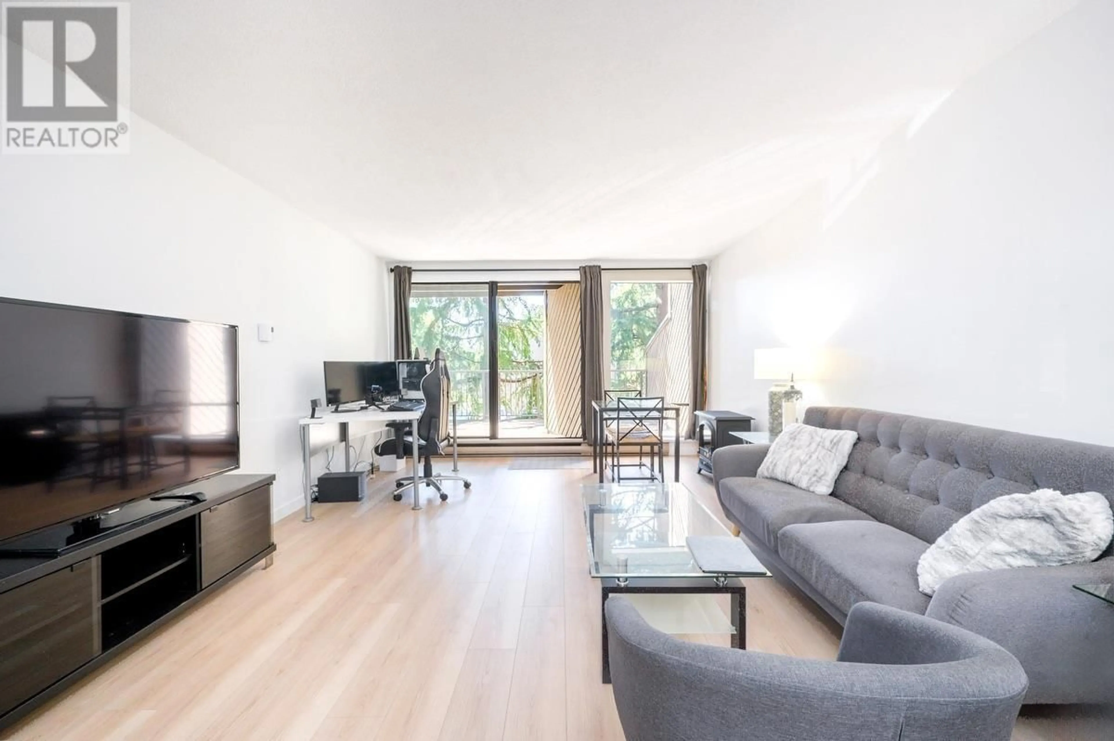 Living room with furniture, wood/laminate floor for 106 - 9300 GLENACRES DRIVE, Richmond British Columbia V7A1Y8