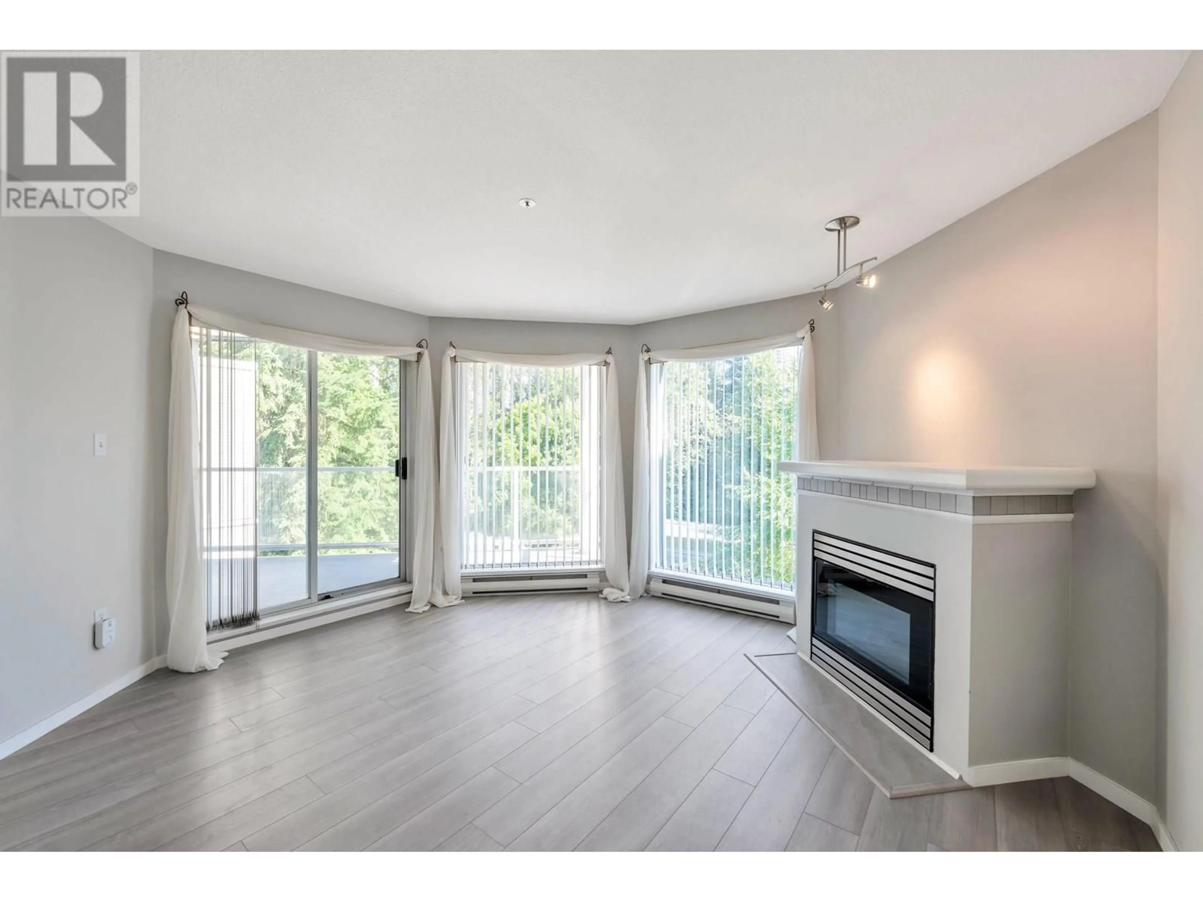 Living room with furniture, wood/laminate floor for 306 - 1219 JOHNSON STREET, Coquitlam British Columbia V3B7L5